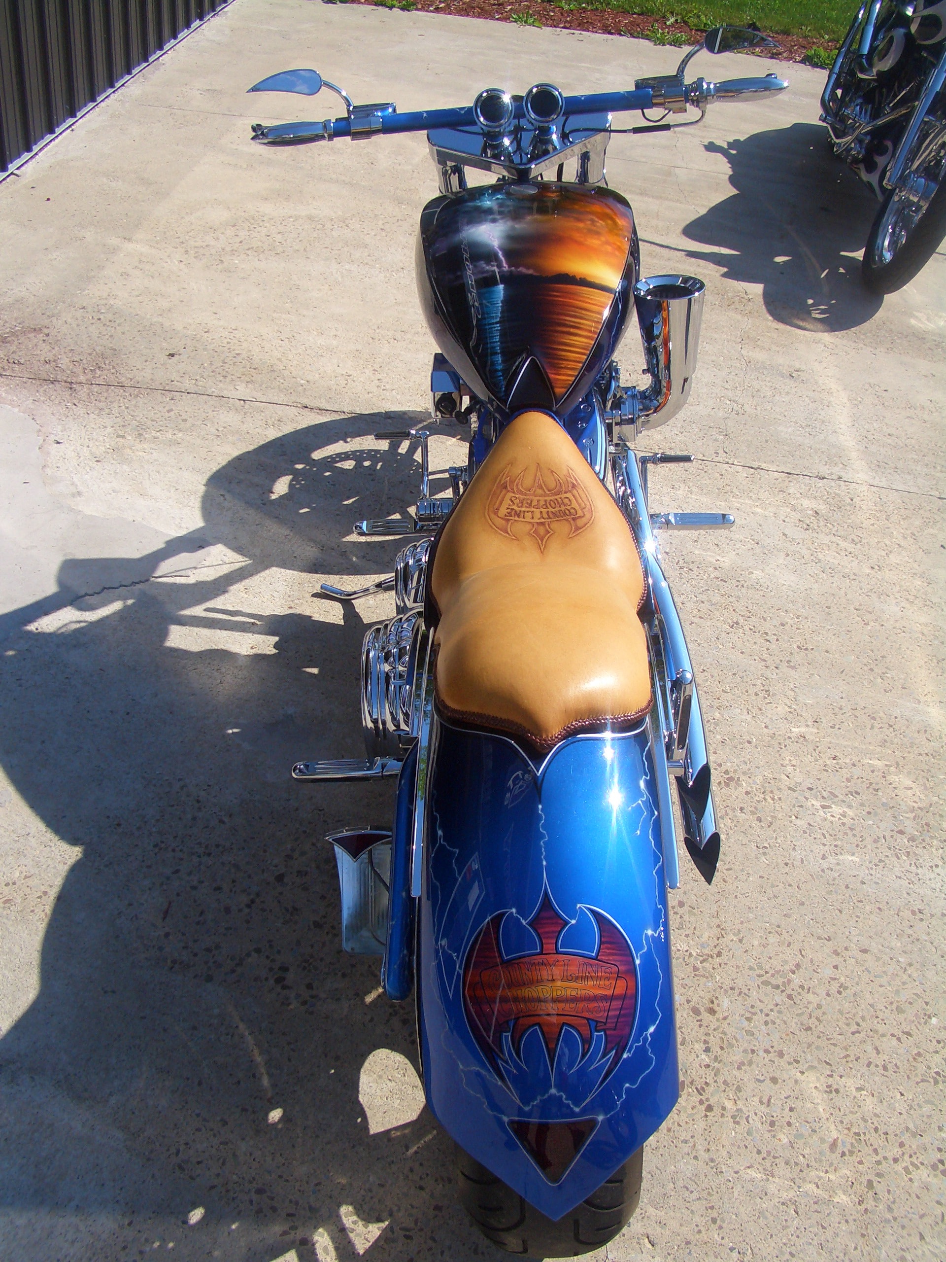 Adirondack — rear overhead, County Line Choppers tooled leather seat and lake scene on tank