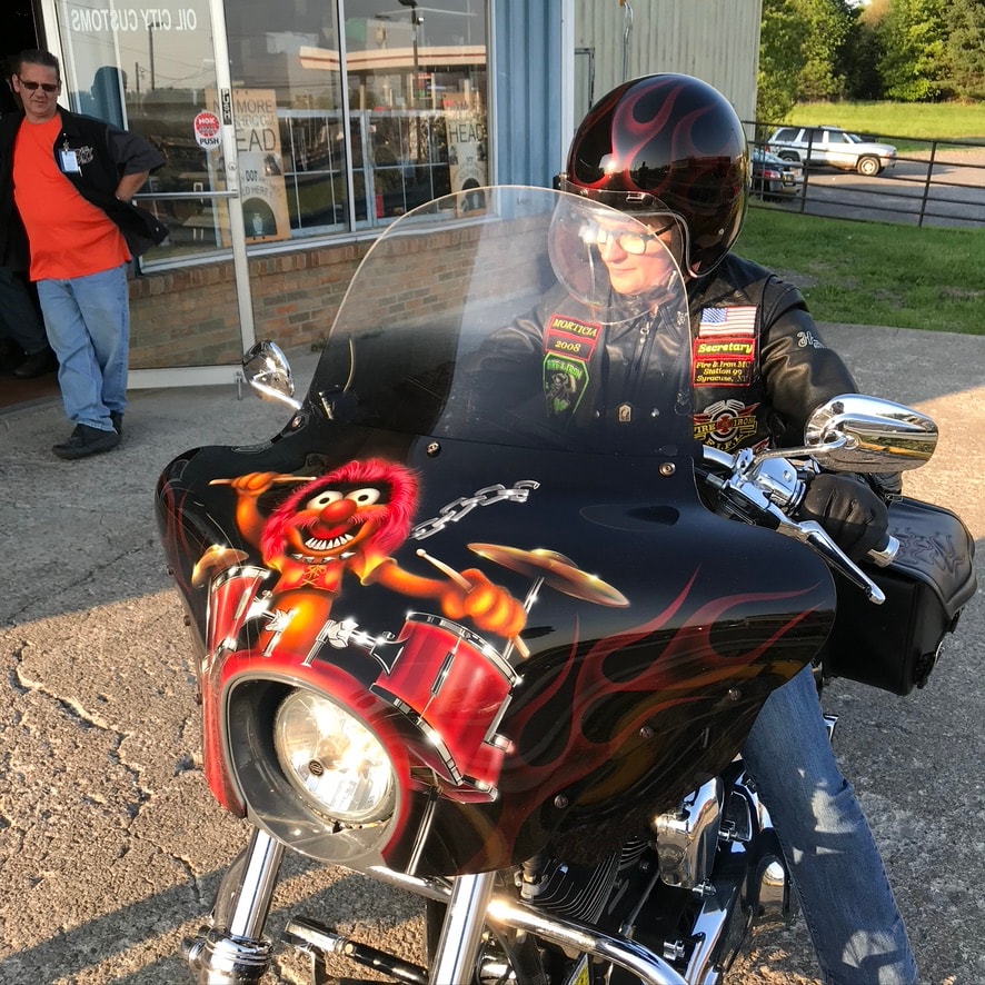 Animal Muppets fairing — rider on the bike, full fairing visible with Animal artwork and ghost flames