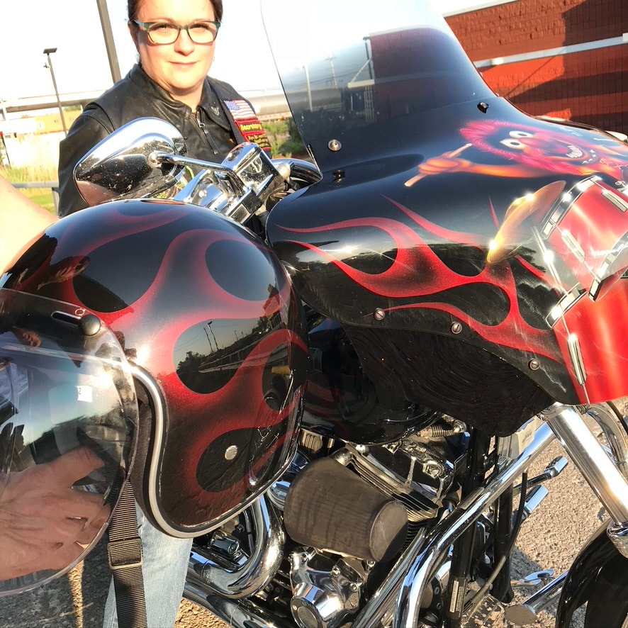 Animal Muppets fairing — matching helmet with Raspberry Metallic ghost flames beside the tank