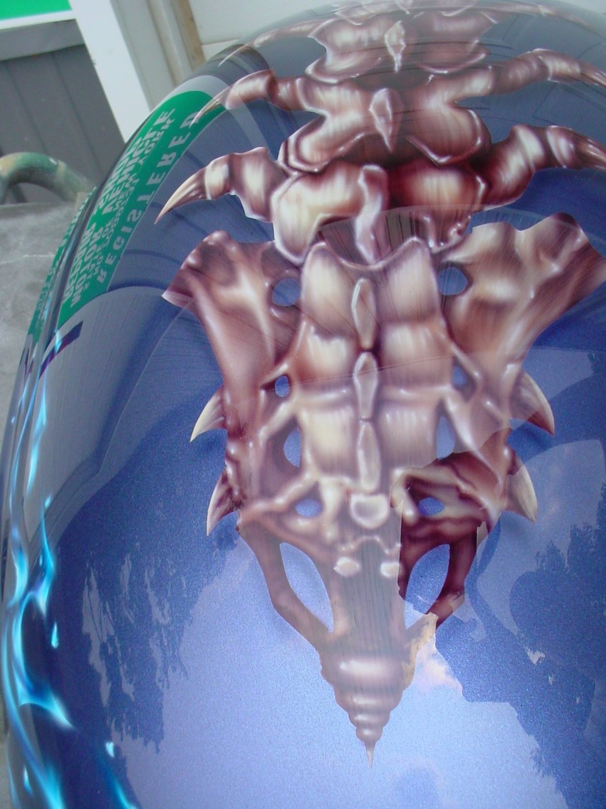 Devil's Advocate — helmet top, skeletal organic crest design on blue metallic