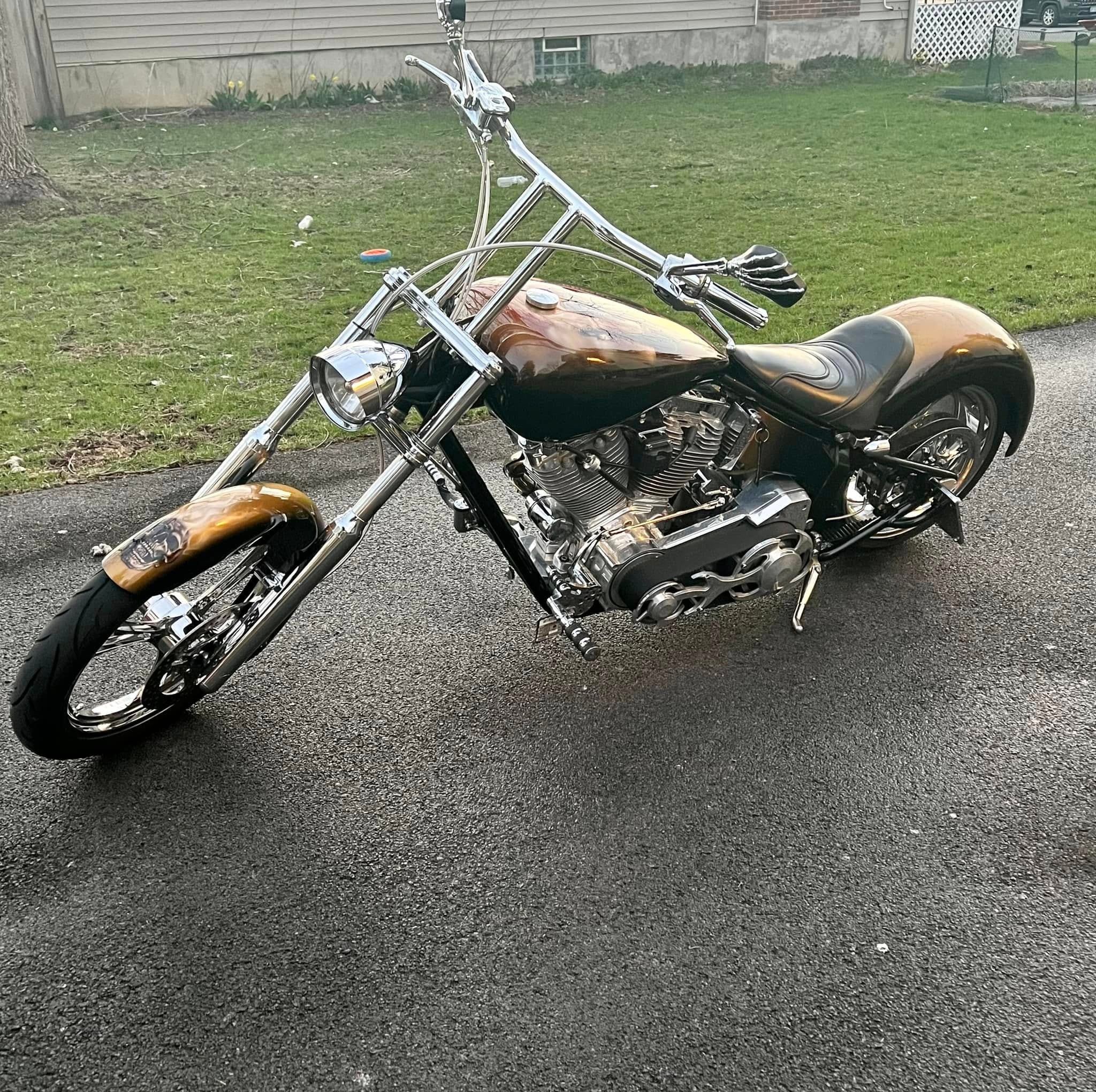 Ryan's Chopper — full bike rear three-quarter, gold and brown metallic with Hades mythology artwork
