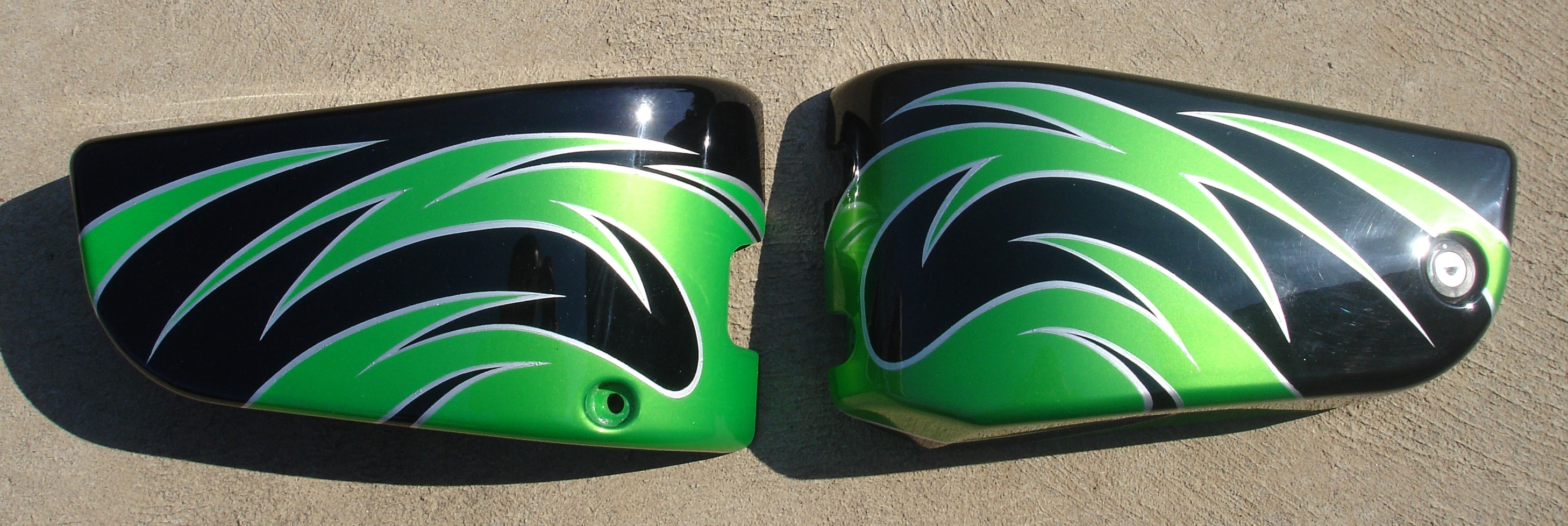 Kawasaki Vulcan 900 — matched pair of side covers, wing-sweep tribal graphics in lime green on black