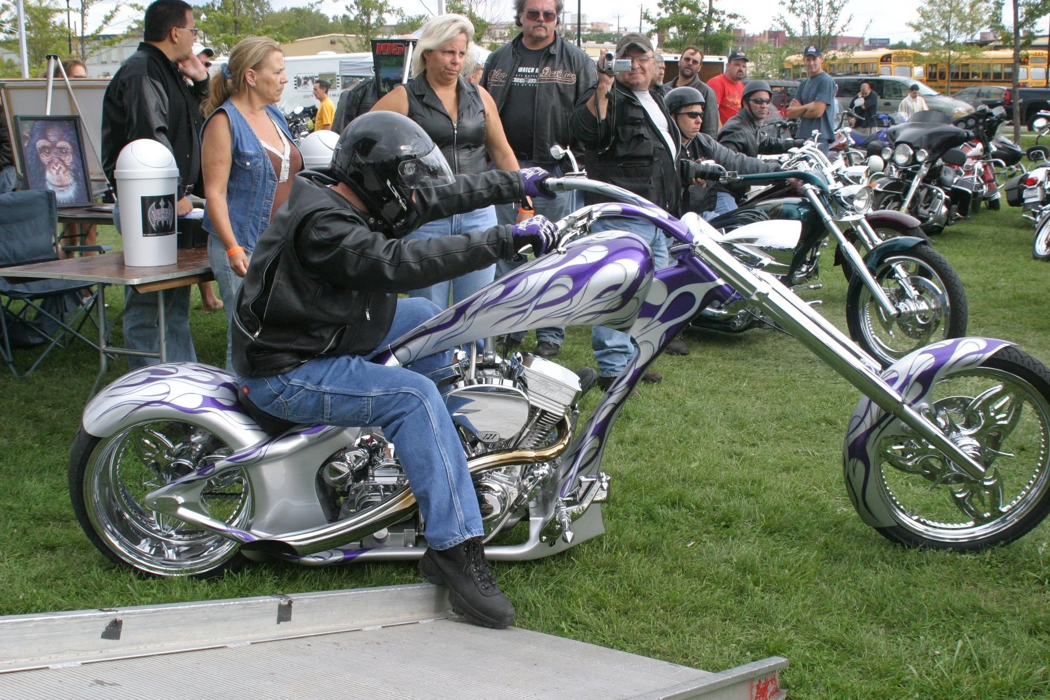 2006 Chick-N-Wing Festival — rider on silver and purple flame custom chopper on festival grounds
