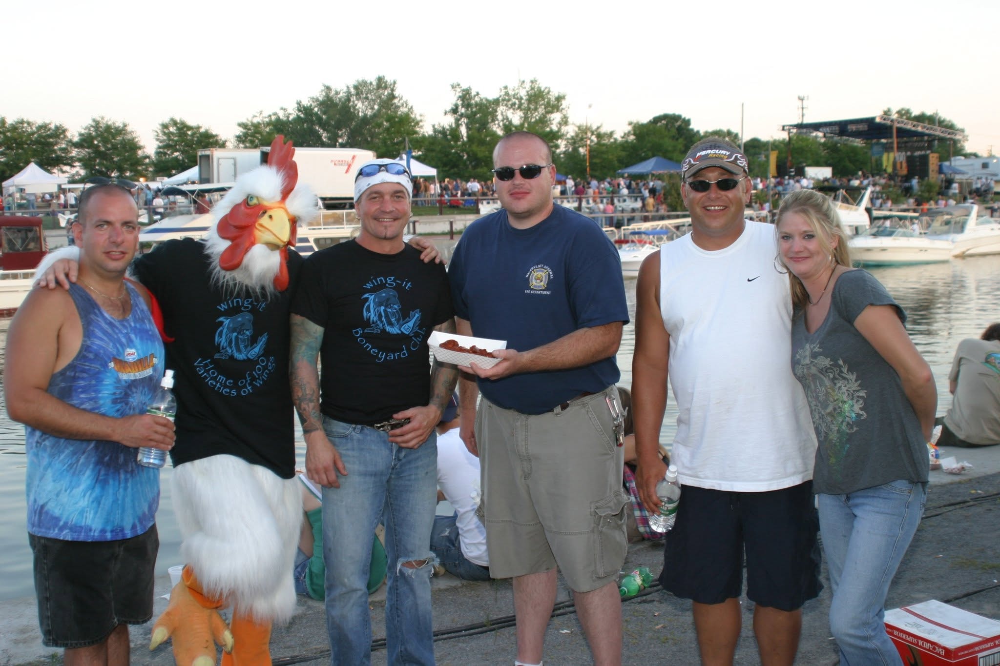 2006 Chick-N-Wing Festival — Wing-It mascot group photo with attendees at Inner Harbor waterfront
