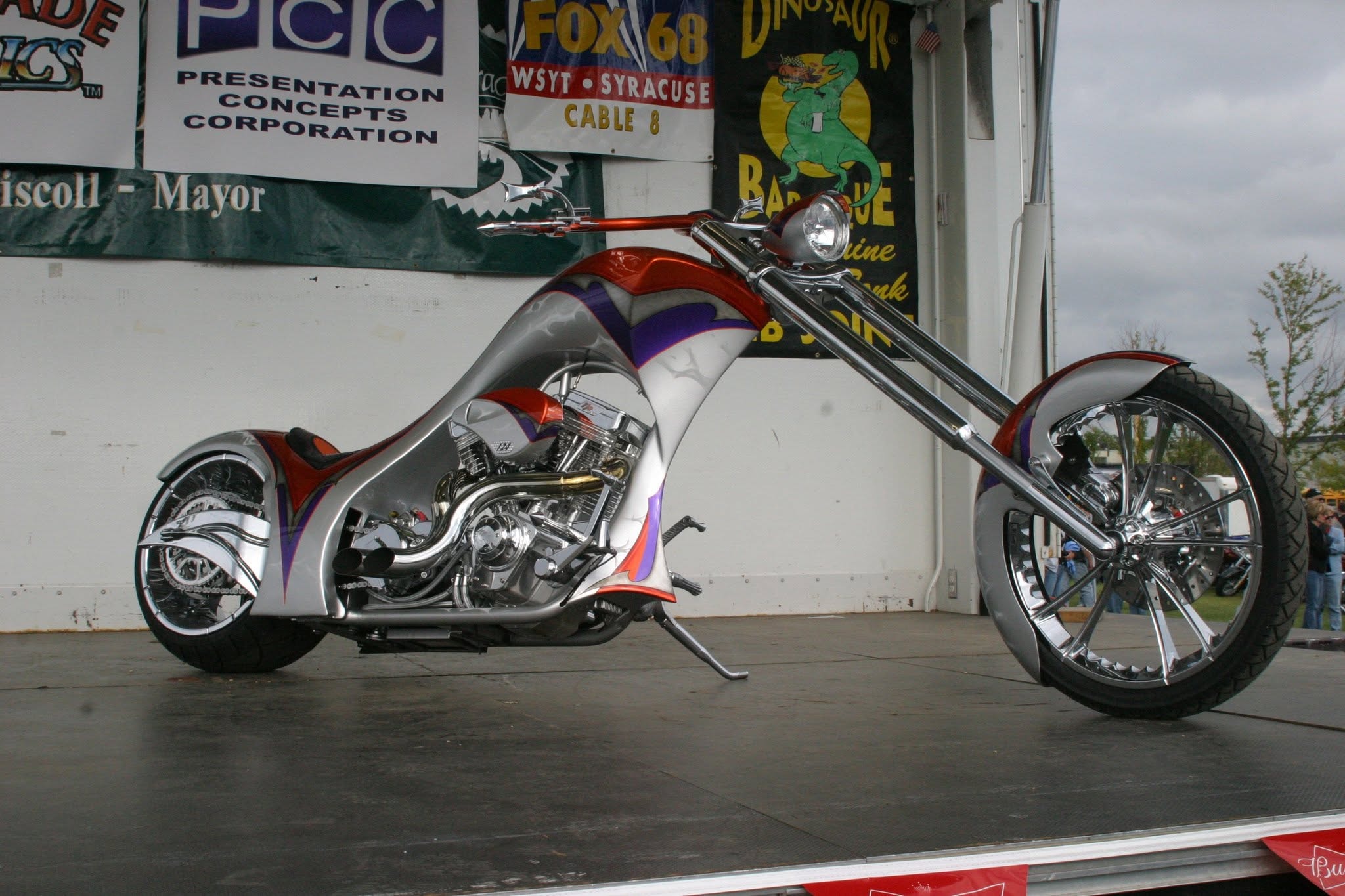 2006 Chick-N-Wing Festival — silver and red custom chopper on stage with Fox 68 WSYT and Dinosaur Bar-B-Que sponsor banners
