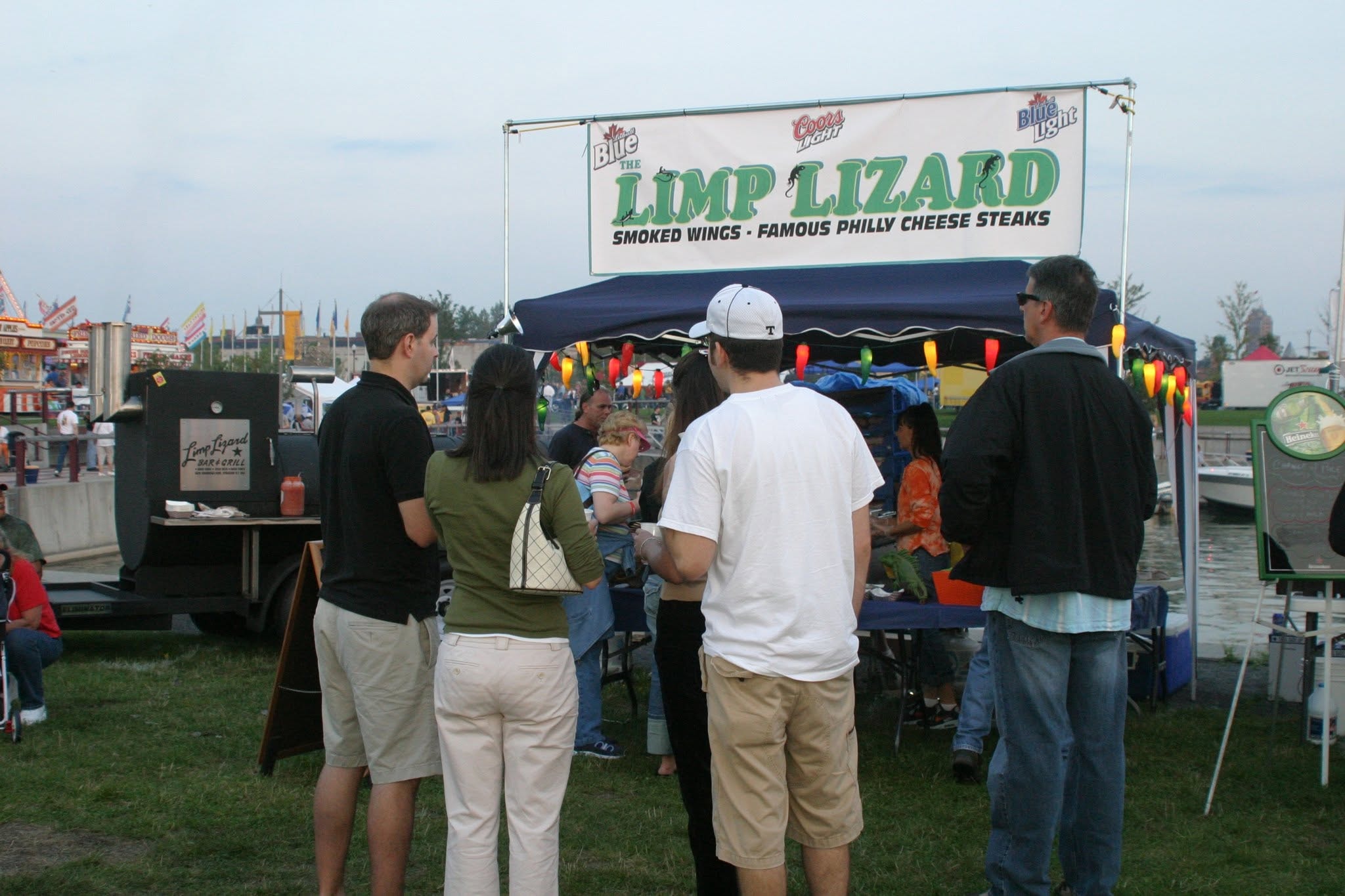 2008 Chick-N-Wing Festival — Limp Lizard Smoked Wings food vendor booth with crowd