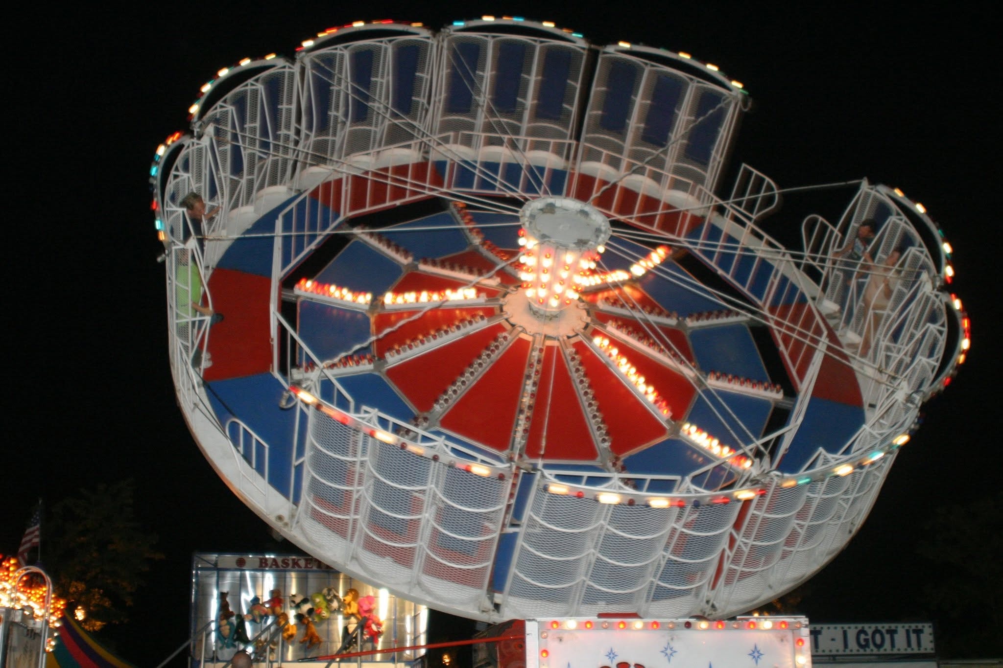 2008 Chick-N-Wing Festival — illuminated Tilt-A-Whirl carnival ride at night