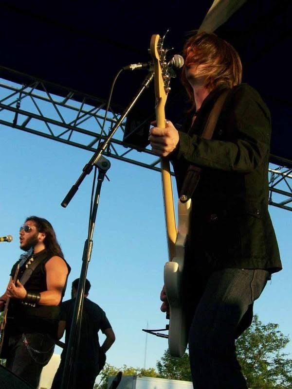 2008 Chick-N-Wing Festival — guitarist performing on outdoor stage at dusk
