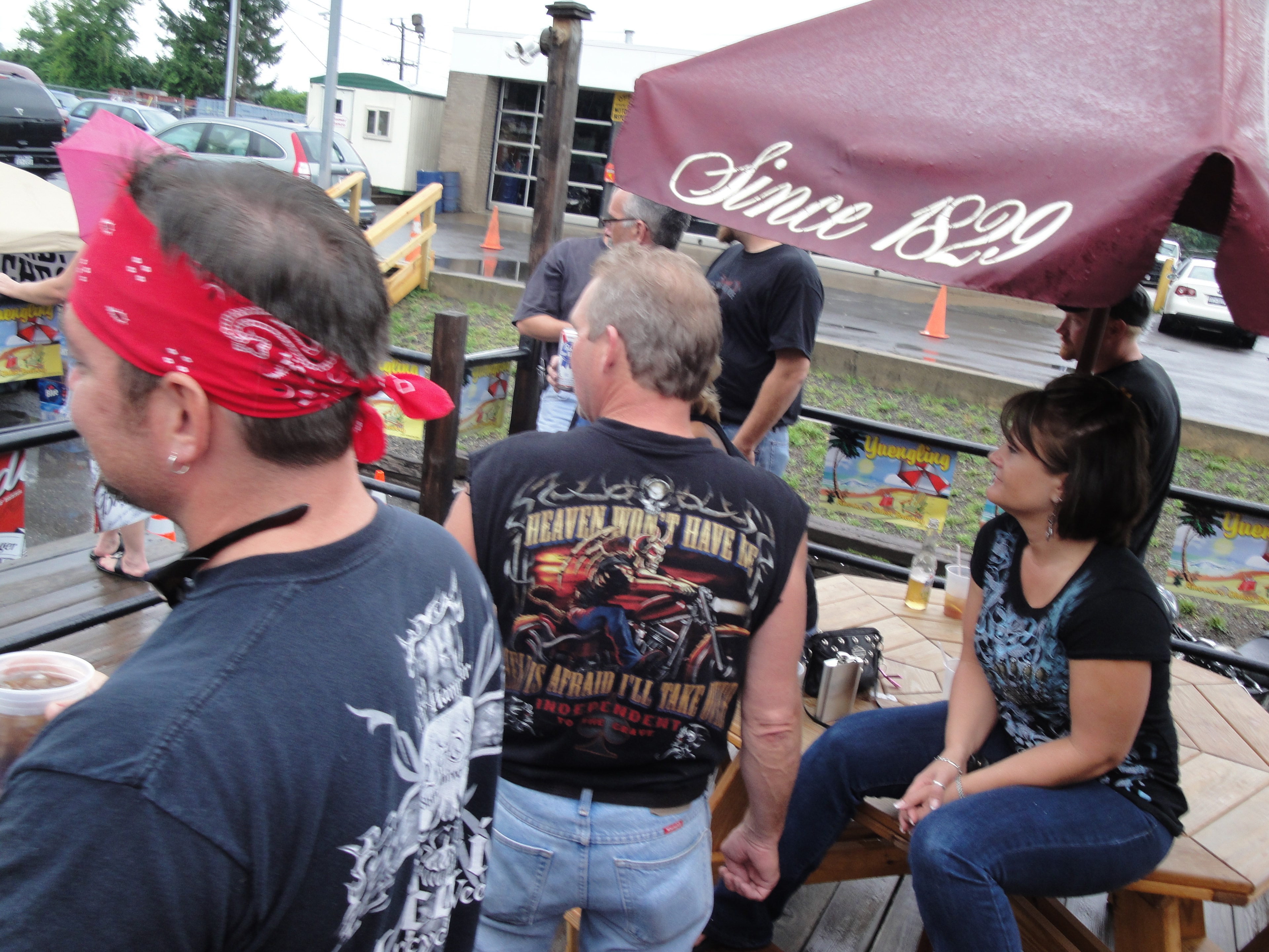 Higie's Iron Horse Saloon Summer BBQ Series — crowd on outdoor patio under Yuengling Since 1829 umbrella