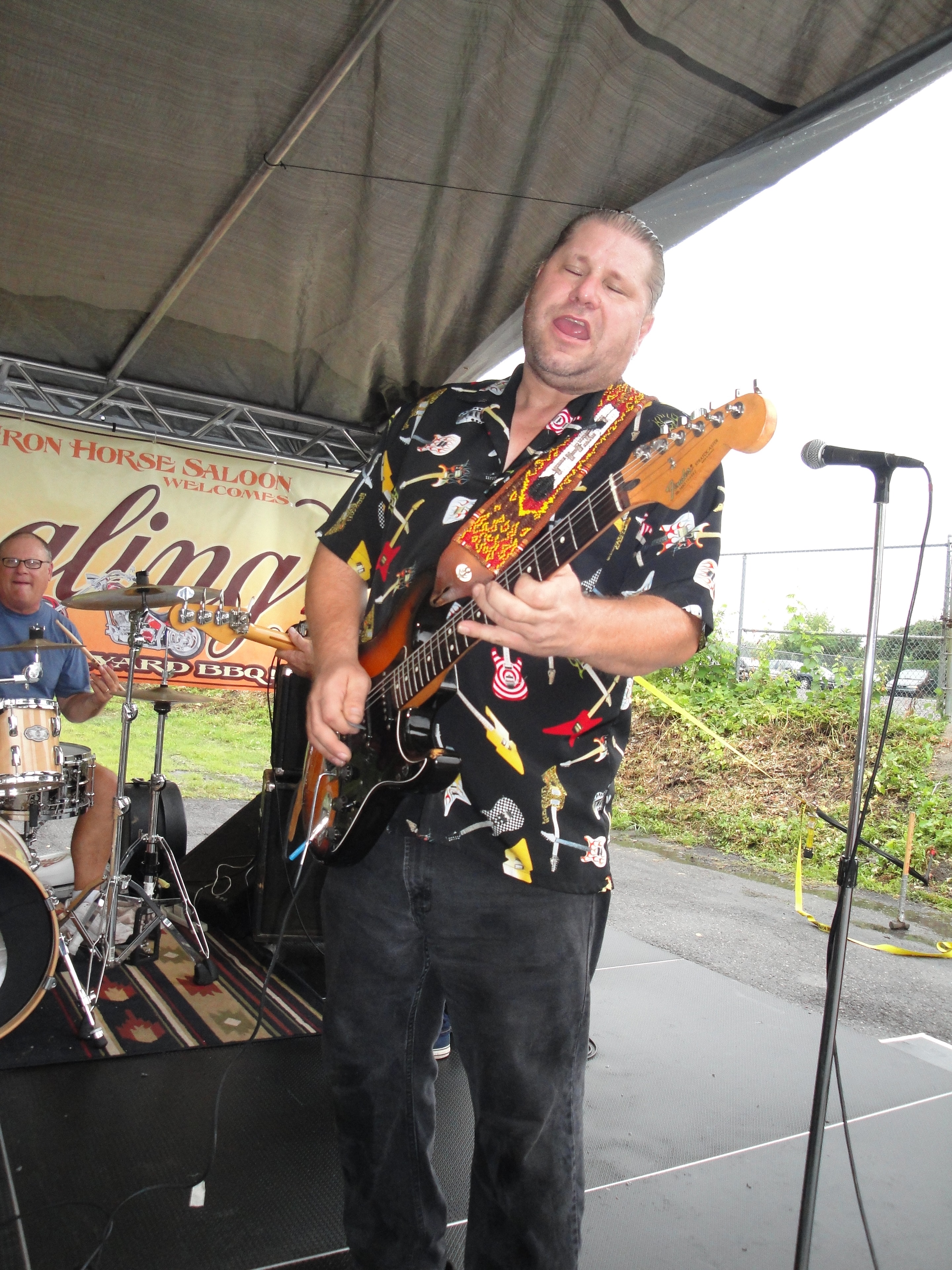 Higie's Iron Horse Saloon Summer BBQ Series — guitarist performing on stage at Iron Horse Saloon BBQ