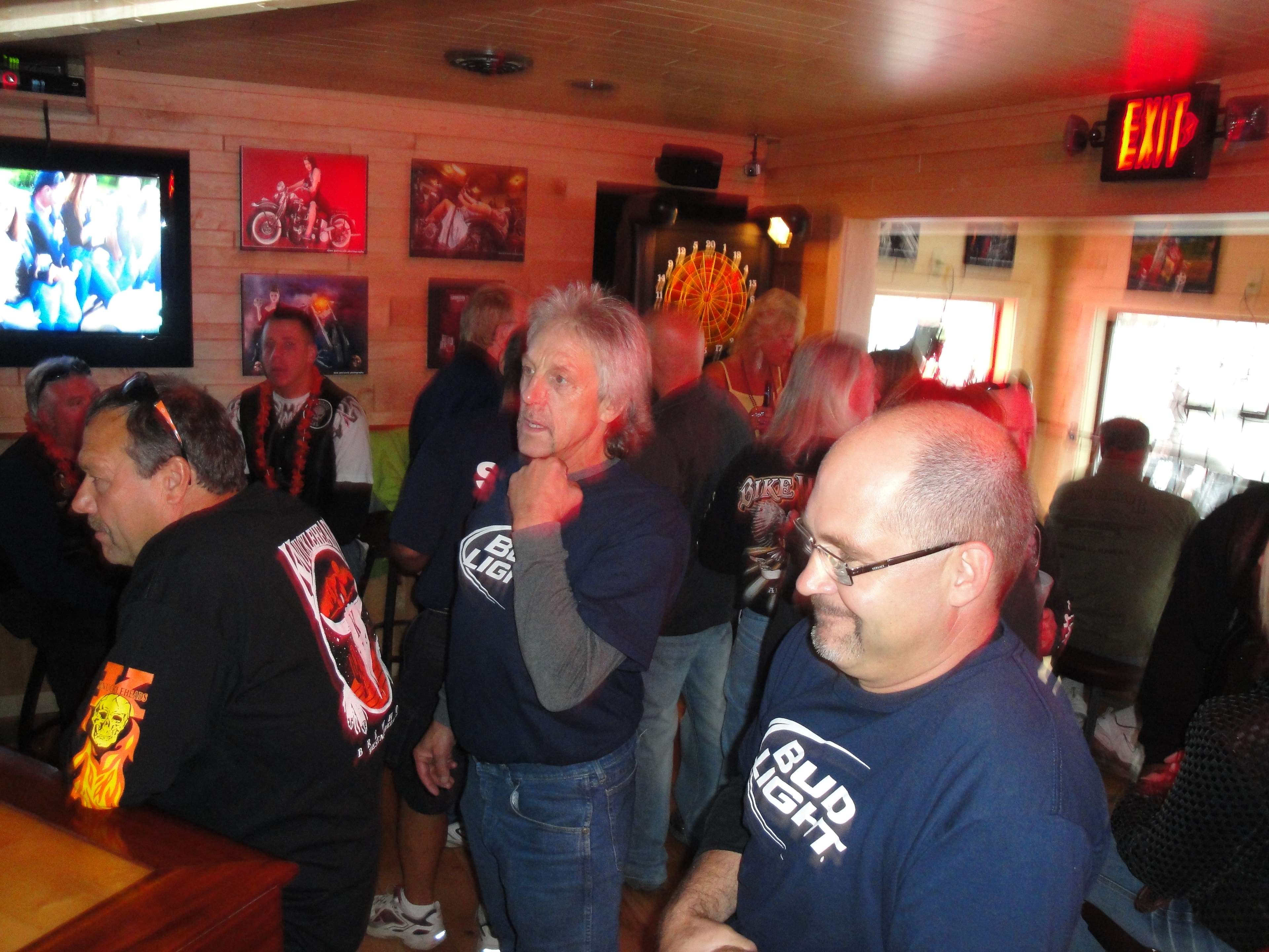 Higie's Iron Horse Saloon Summer BBQ Series — packed crowd inside the Iron Horse Saloon bar with red ambient lighting
