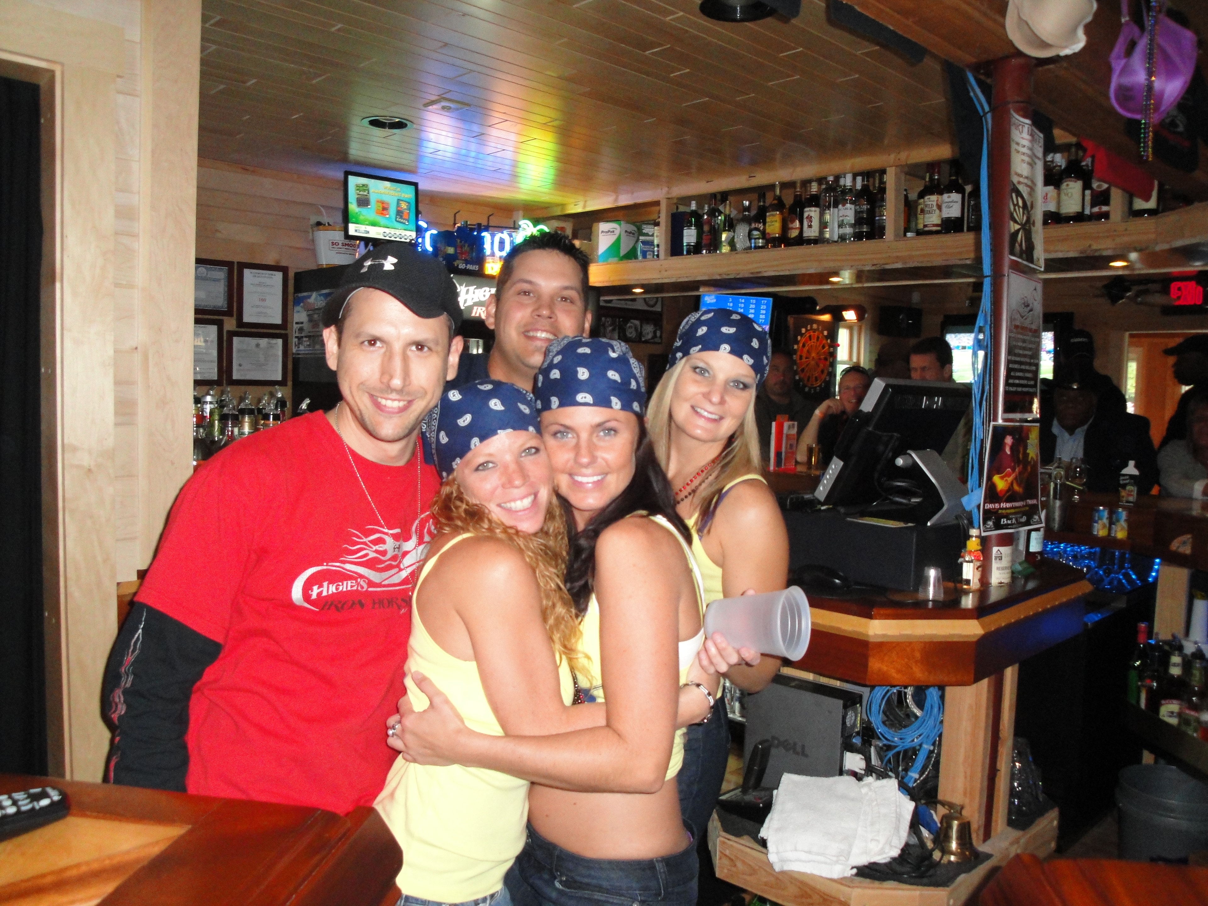 Higie's Iron Horse Saloon Summer BBQ Series — group of five posing at the Iron Horse Saloon bar