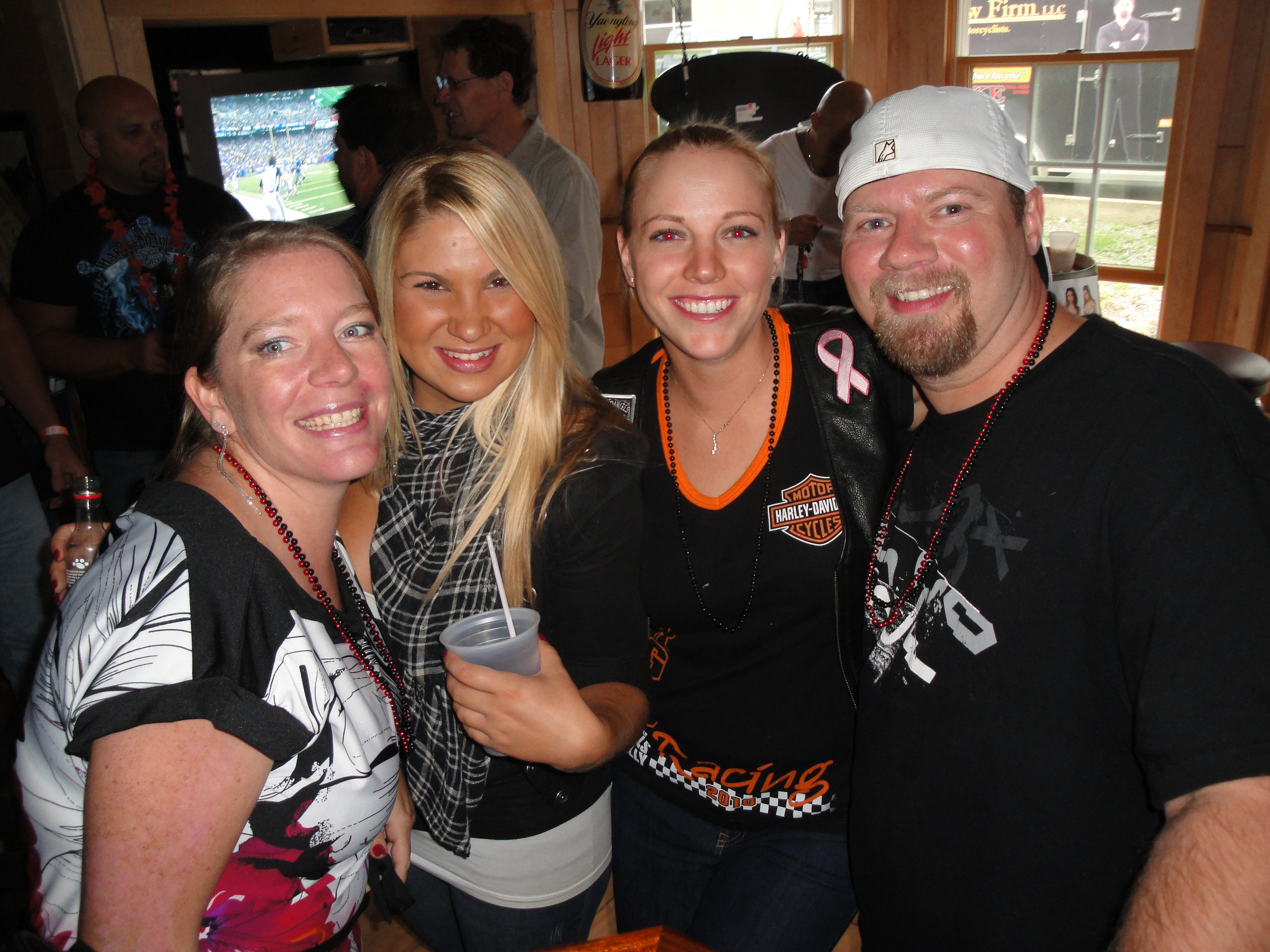 Higie's Iron Horse Saloon Summer BBQ Series — four people posing inside the Iron Horse Saloon