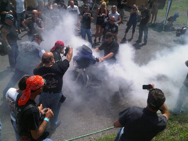 Higie's Iron Horse Saloon Summer BBQ Series — burnout smoke crowd overhead