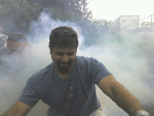 Higie's Iron Horse Saloon Summer BBQ Series — man in burnout smoke grinning