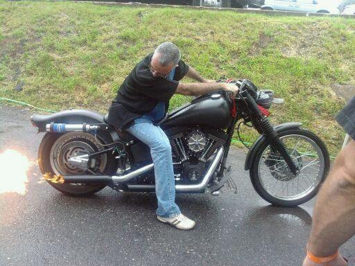 Higie's Iron Horse Saloon Summer BBQ Series — man on black Harley with exhaust flames