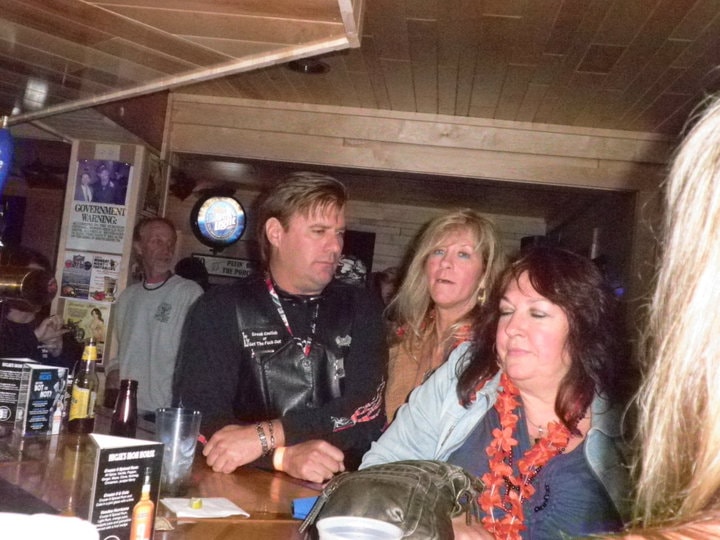 Higie's Iron Horse Saloon Summer BBQ Series — group at the bar inside the saloon