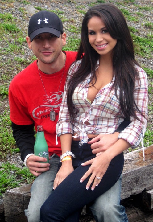 Higie's Iron Horse Saloon Summer BBQ Series — couple sitting on log outside