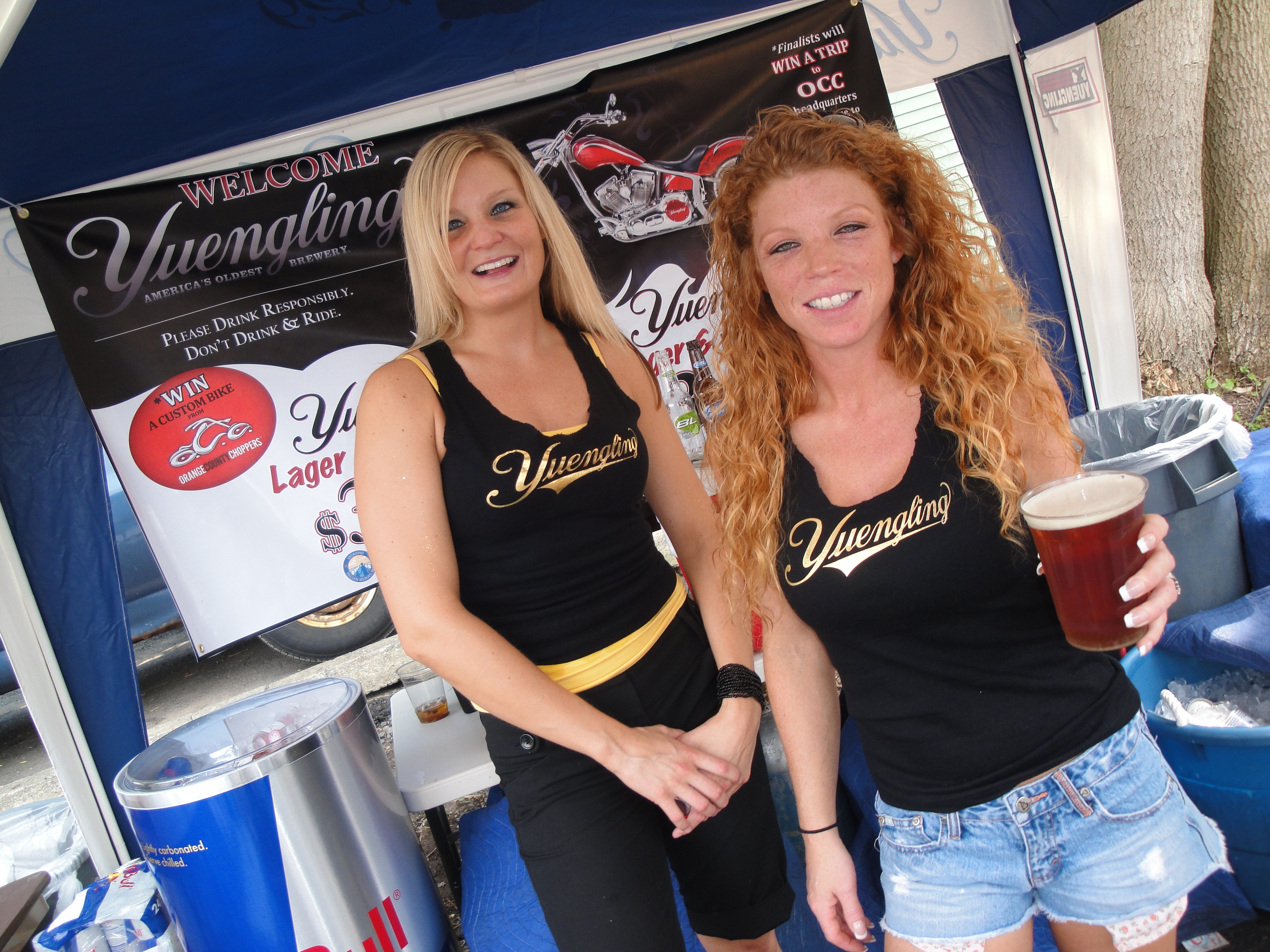 Higie's Iron Horse Saloon Summer BBQ Series — two Yuengling promo girls at sponsor tent