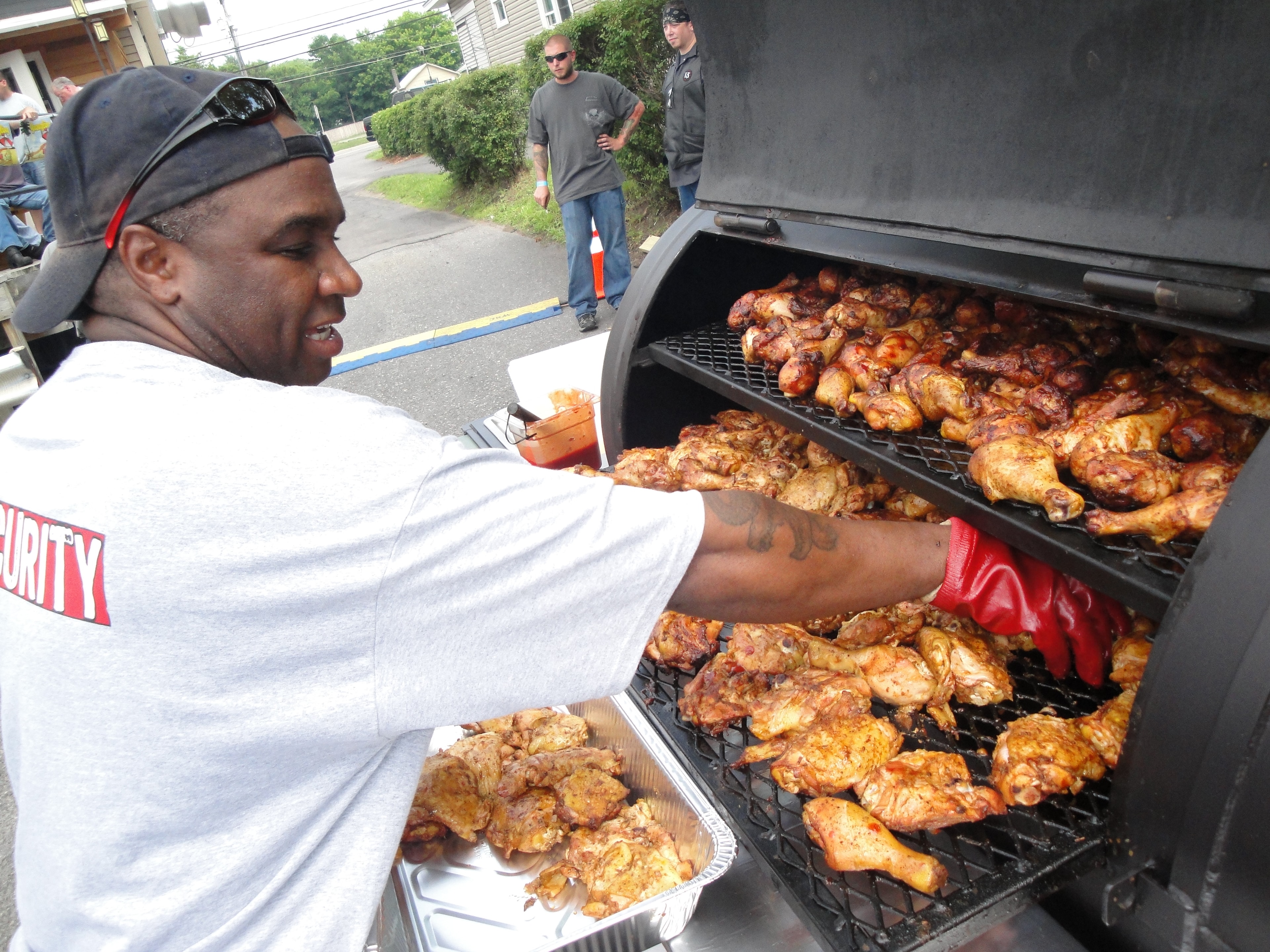 Higie's Iron Horse Saloon Summer BBQ Series — pitmaster grilling chicken on large smoker