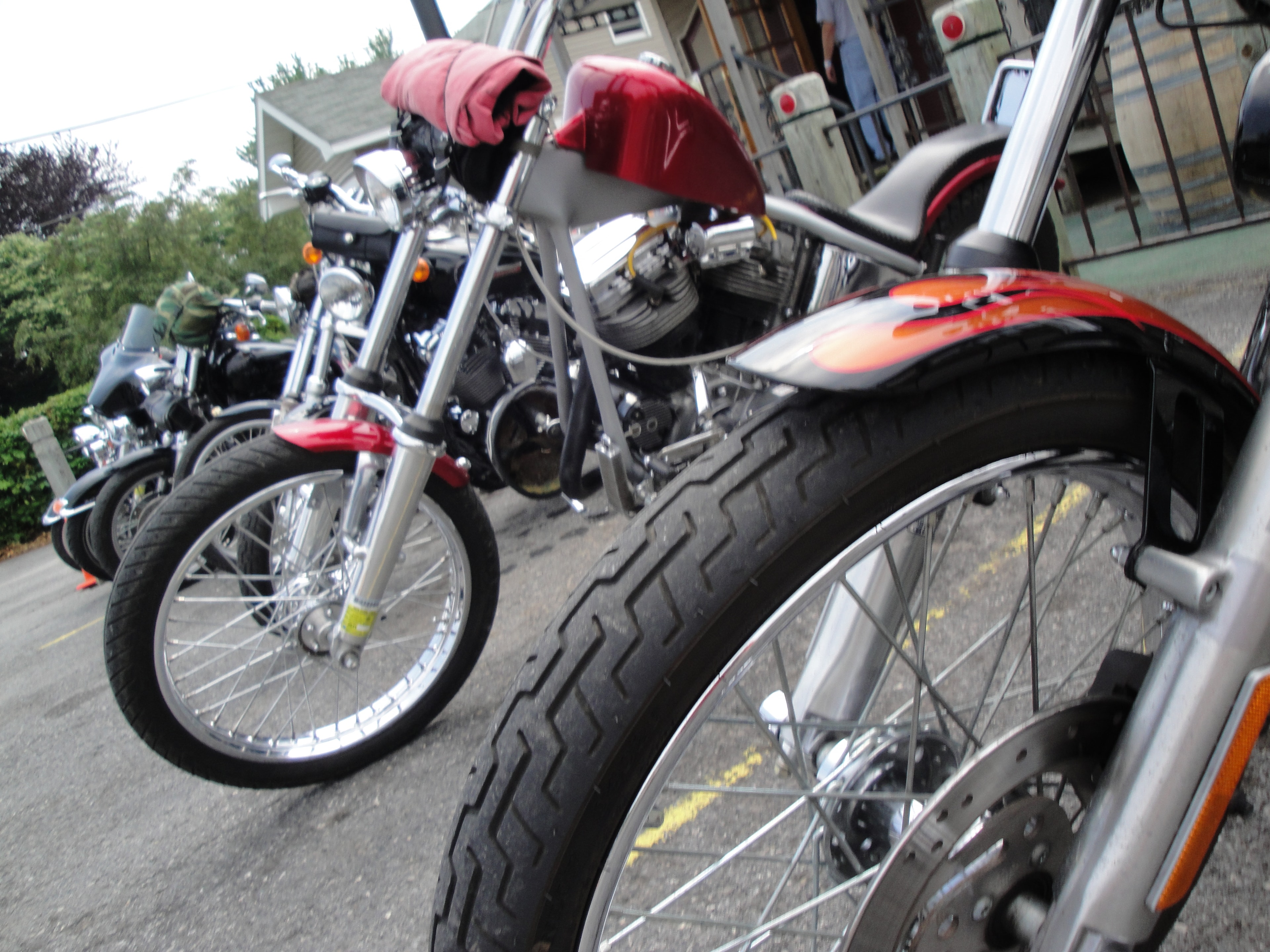 Higie's Iron Horse Saloon Summer BBQ Series — custom choppers parked close-up wheel detail