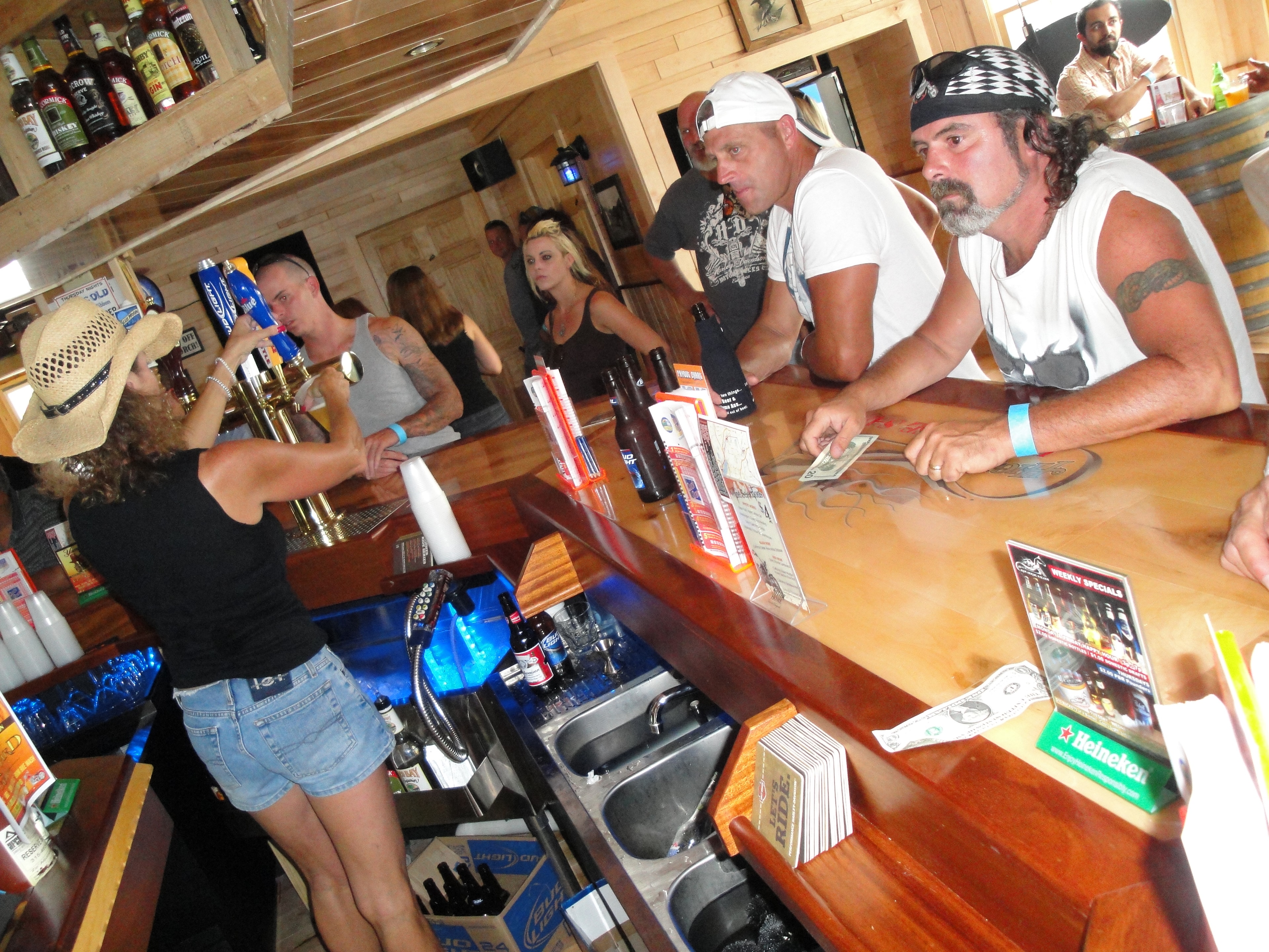 Higie's Iron Horse Saloon Summer BBQ Series — bartender serving patrons at the bar