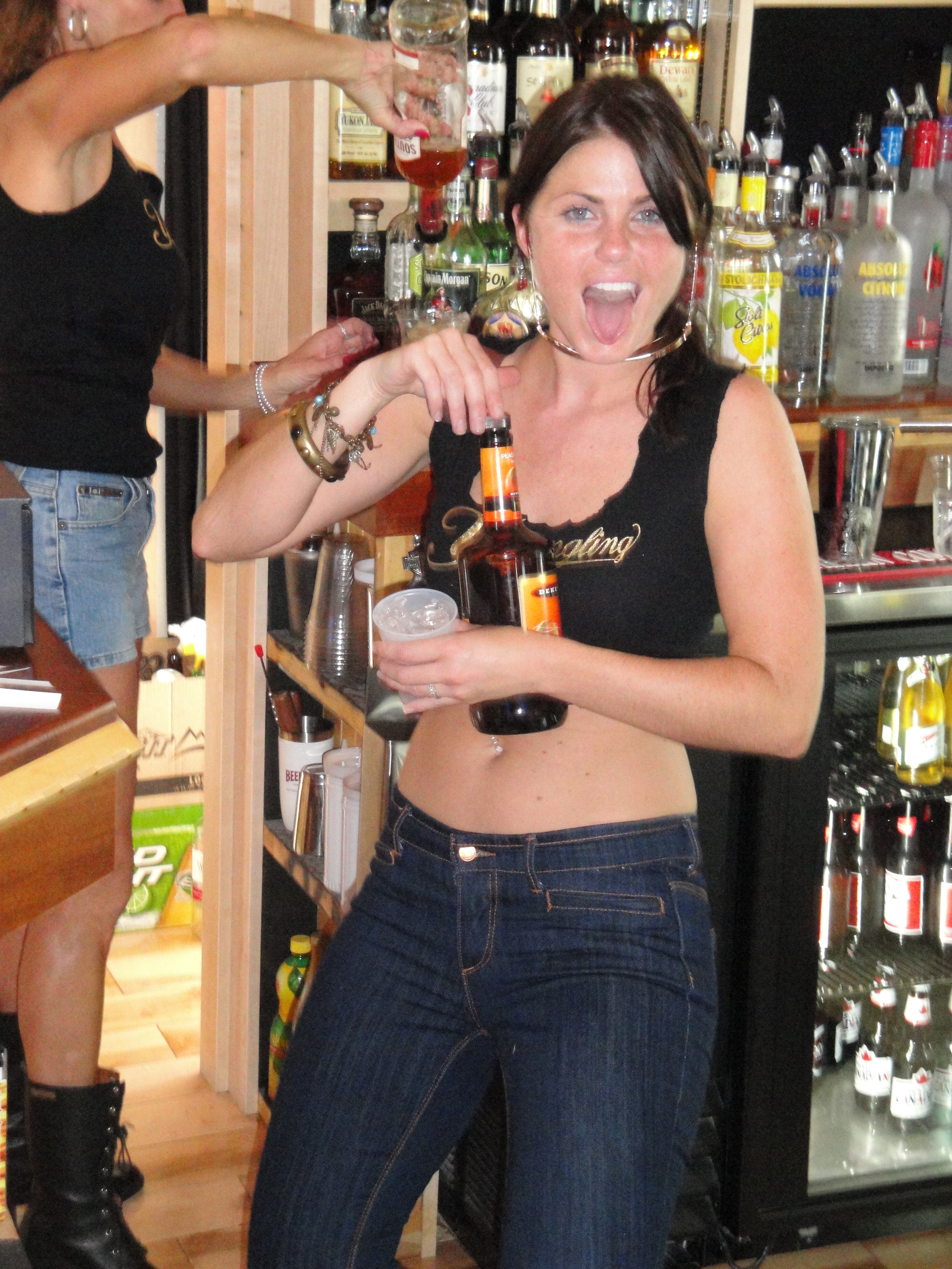 Higie's Iron Horse Saloon Summer BBQ Series — bartender pouring shots behind the bar