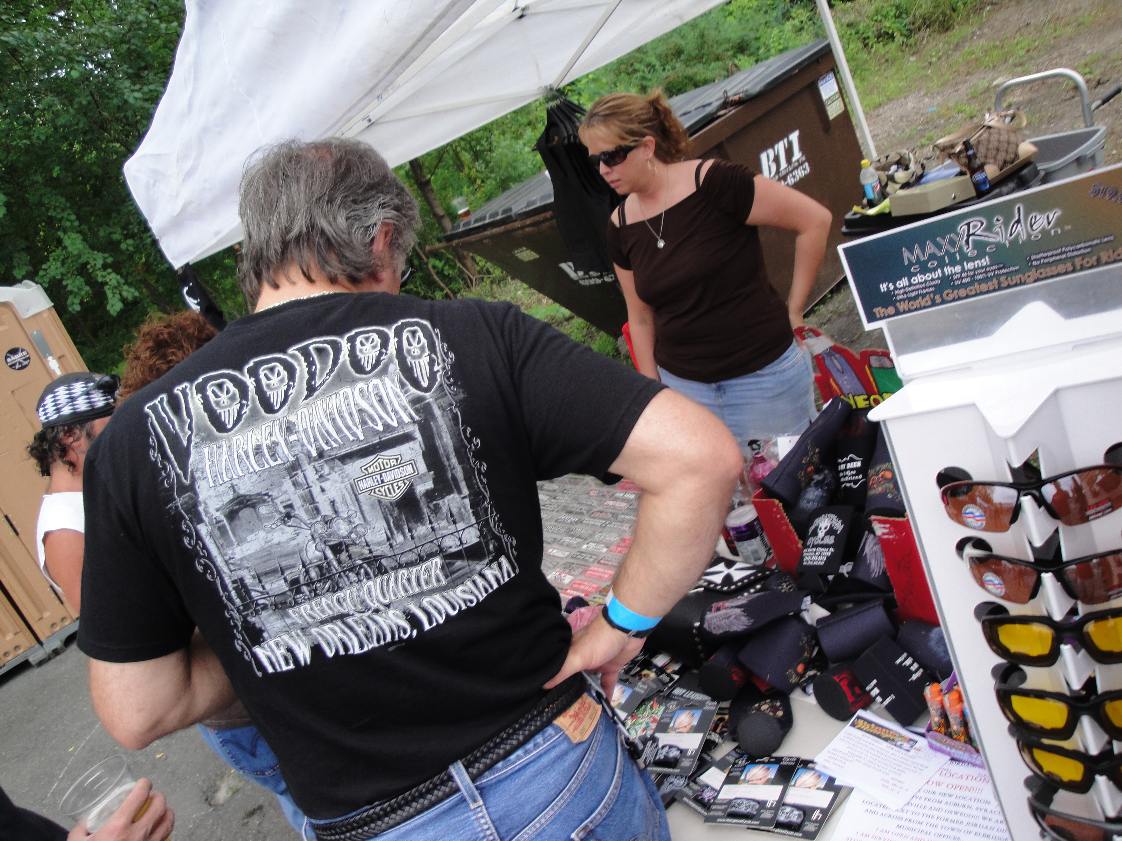 Higie's Iron Horse Saloon Summer BBQ Series — vendor browsing Maxx Rider sunglasses booth