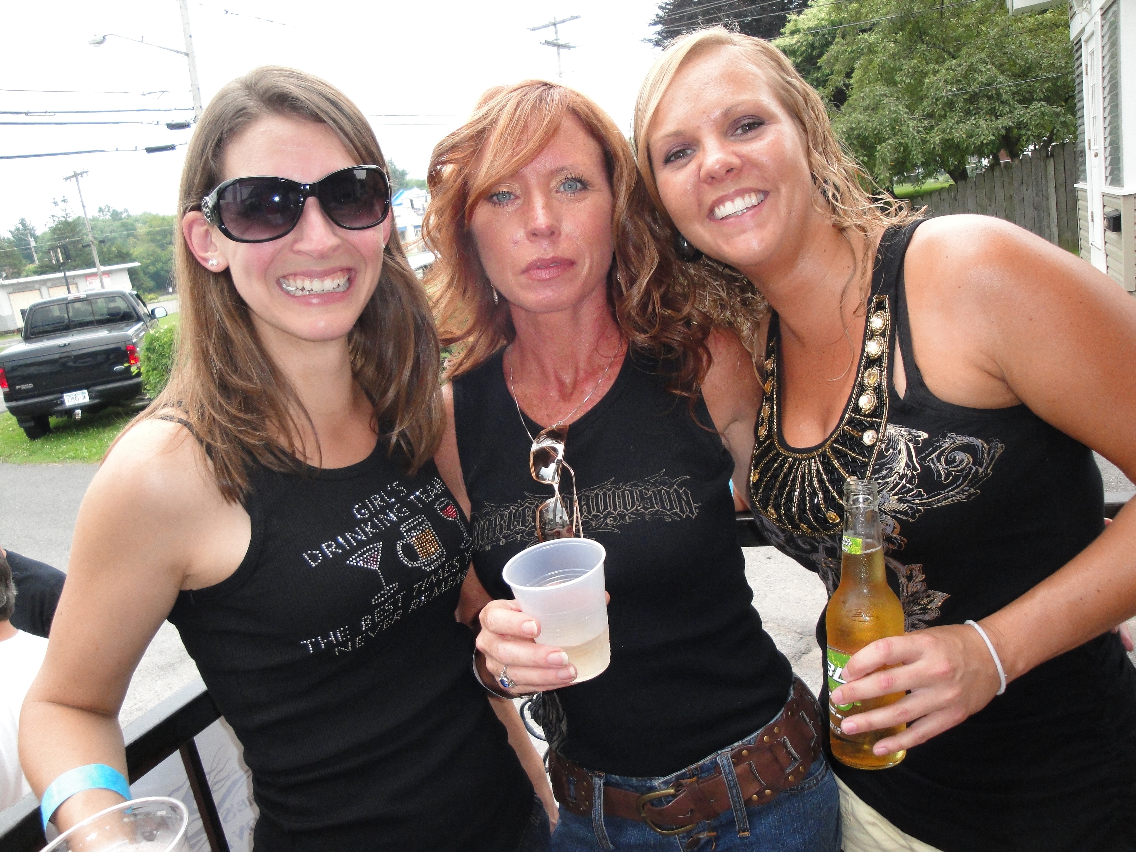 Higie's Iron Horse Saloon Summer BBQ Series — three women posing outside the saloon