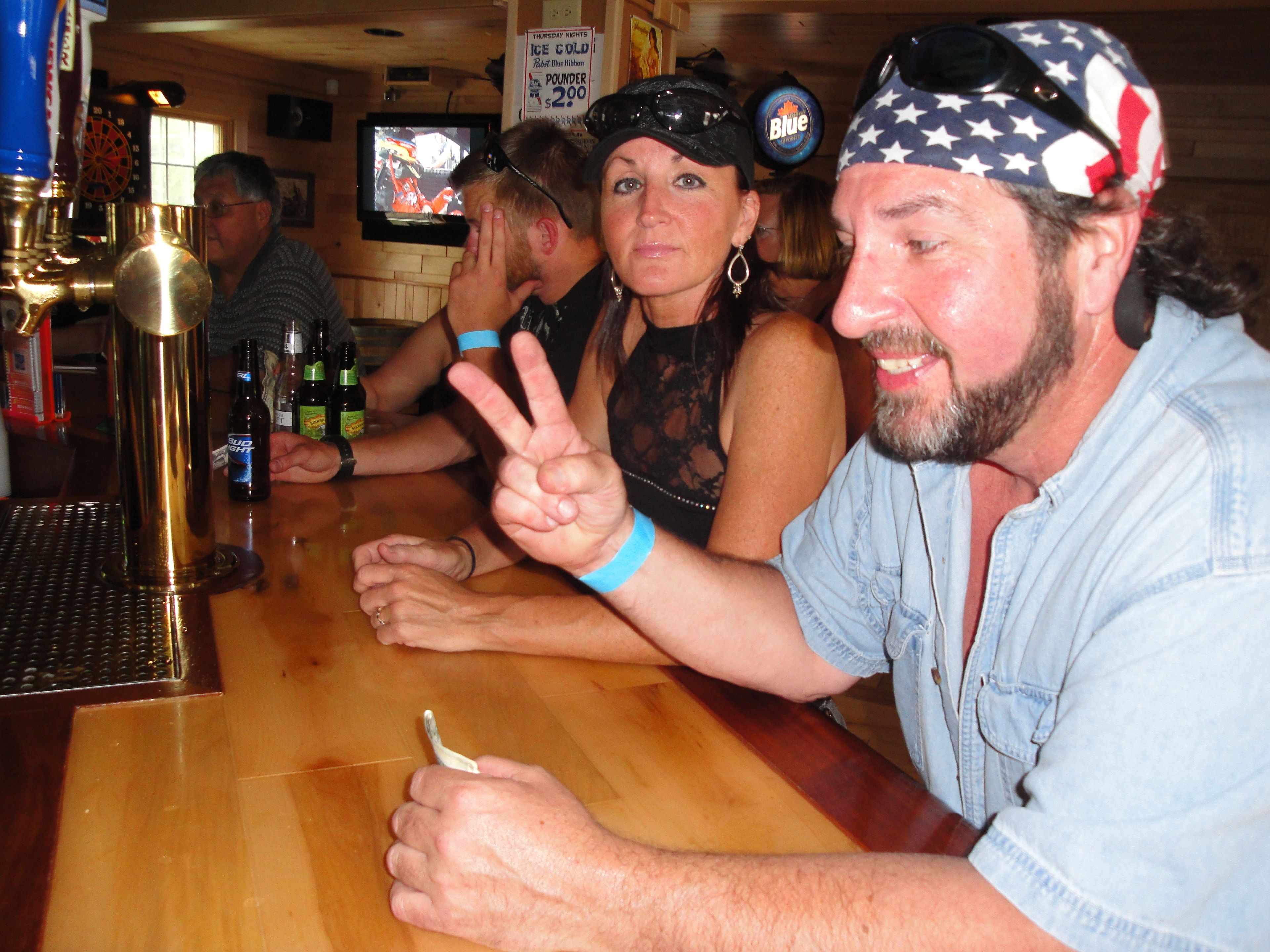Higie's Iron Horse Saloon Summer BBQ Series — couple at the bar inside the saloon