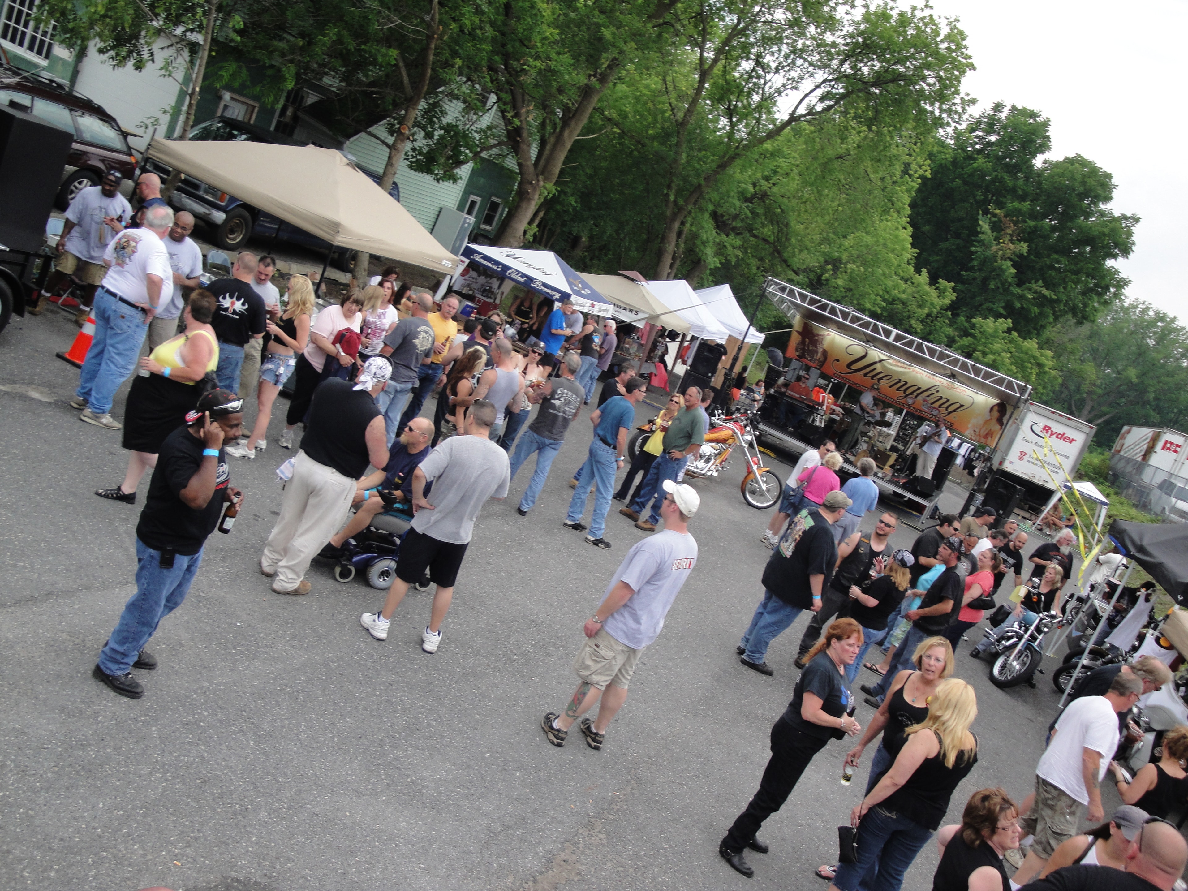 Higie's Iron Horse Saloon Summer BBQ Series — large crowd at outdoor event with Yuengling stage