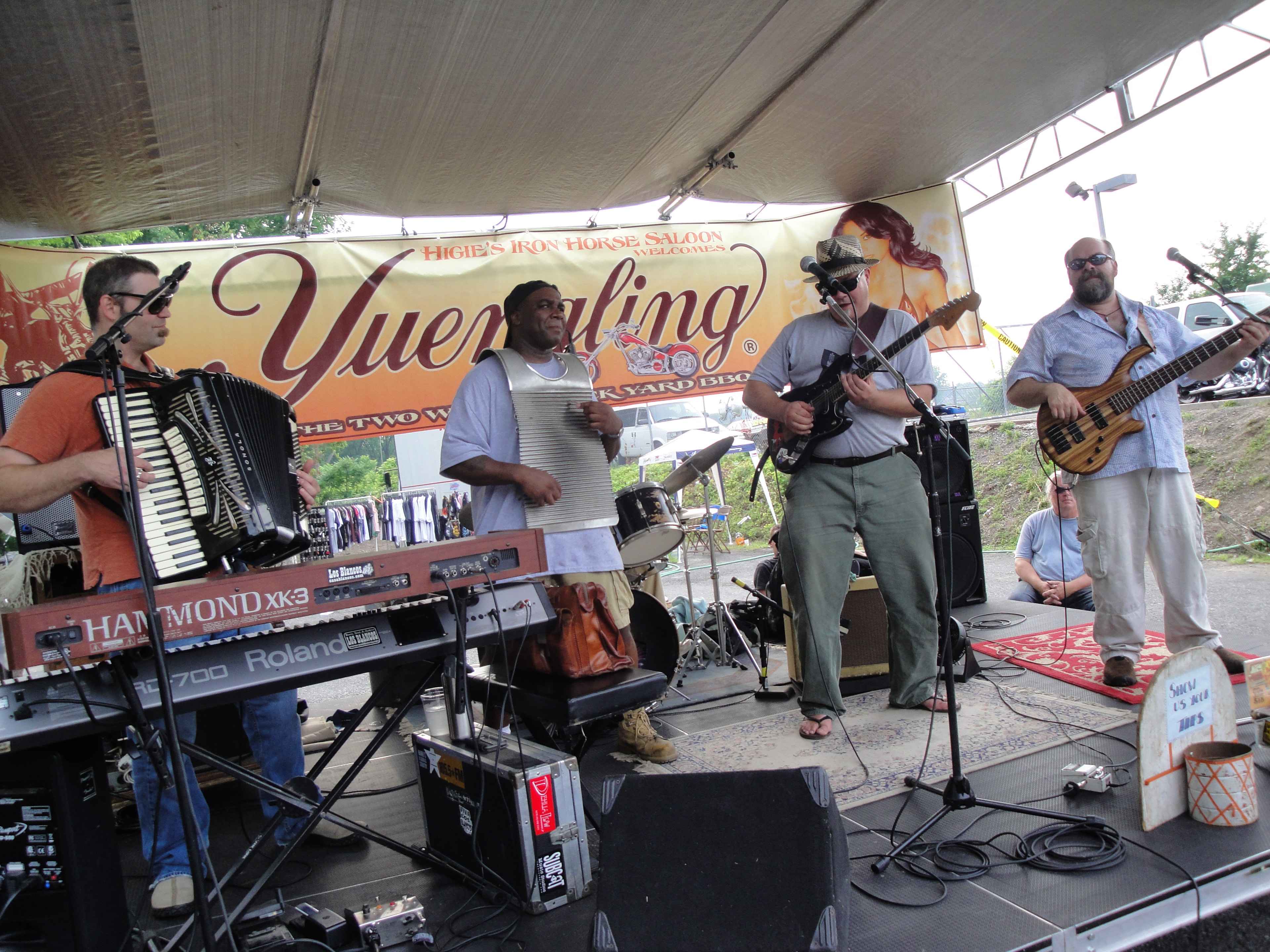 Higie's Iron Horse Saloon Summer BBQ Series — full band with accordion and washboard under Yuengling banner