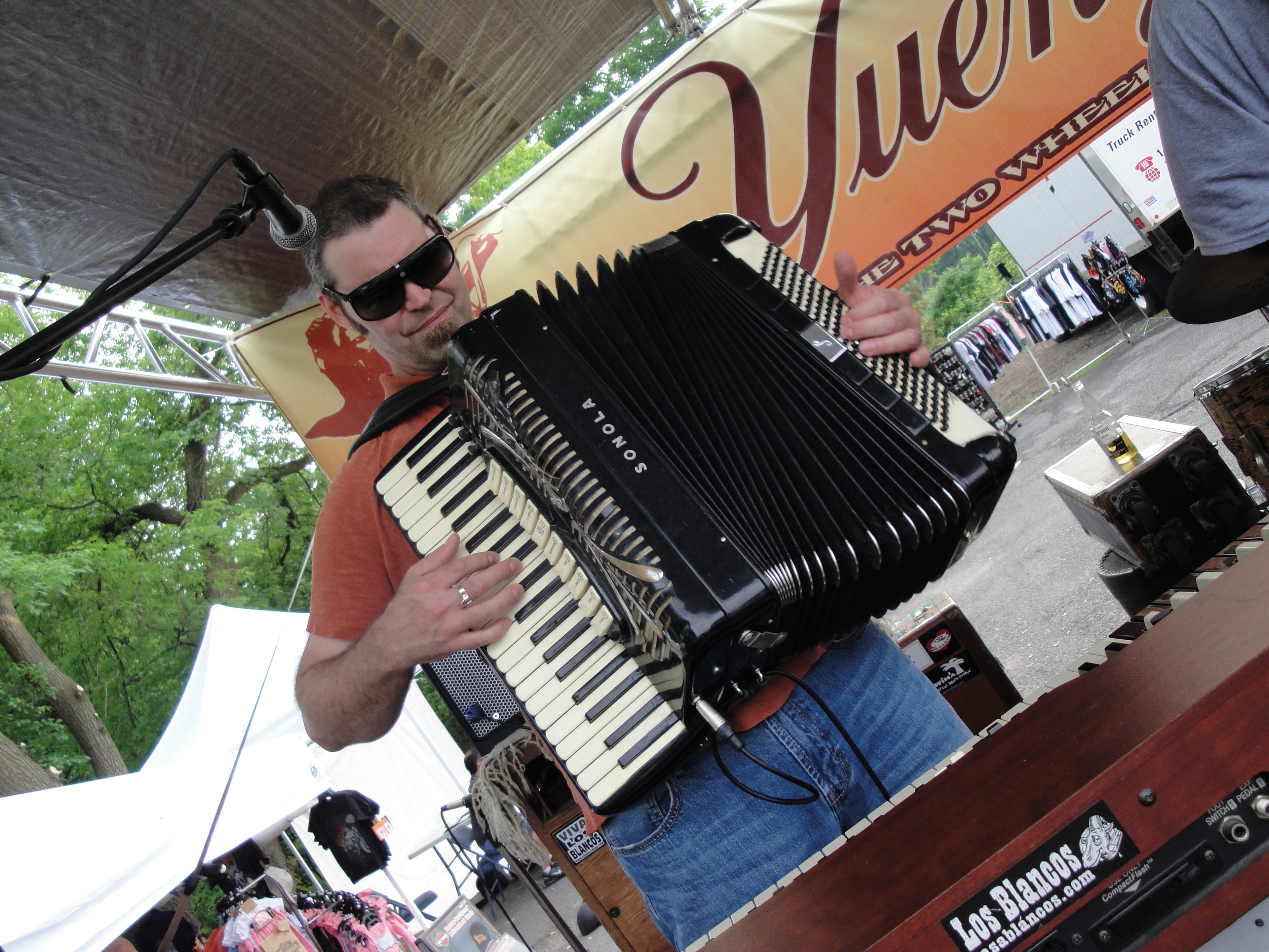 Higie's Iron Horse Saloon Summer BBQ Series — accordion player on stage with Yuengling banner