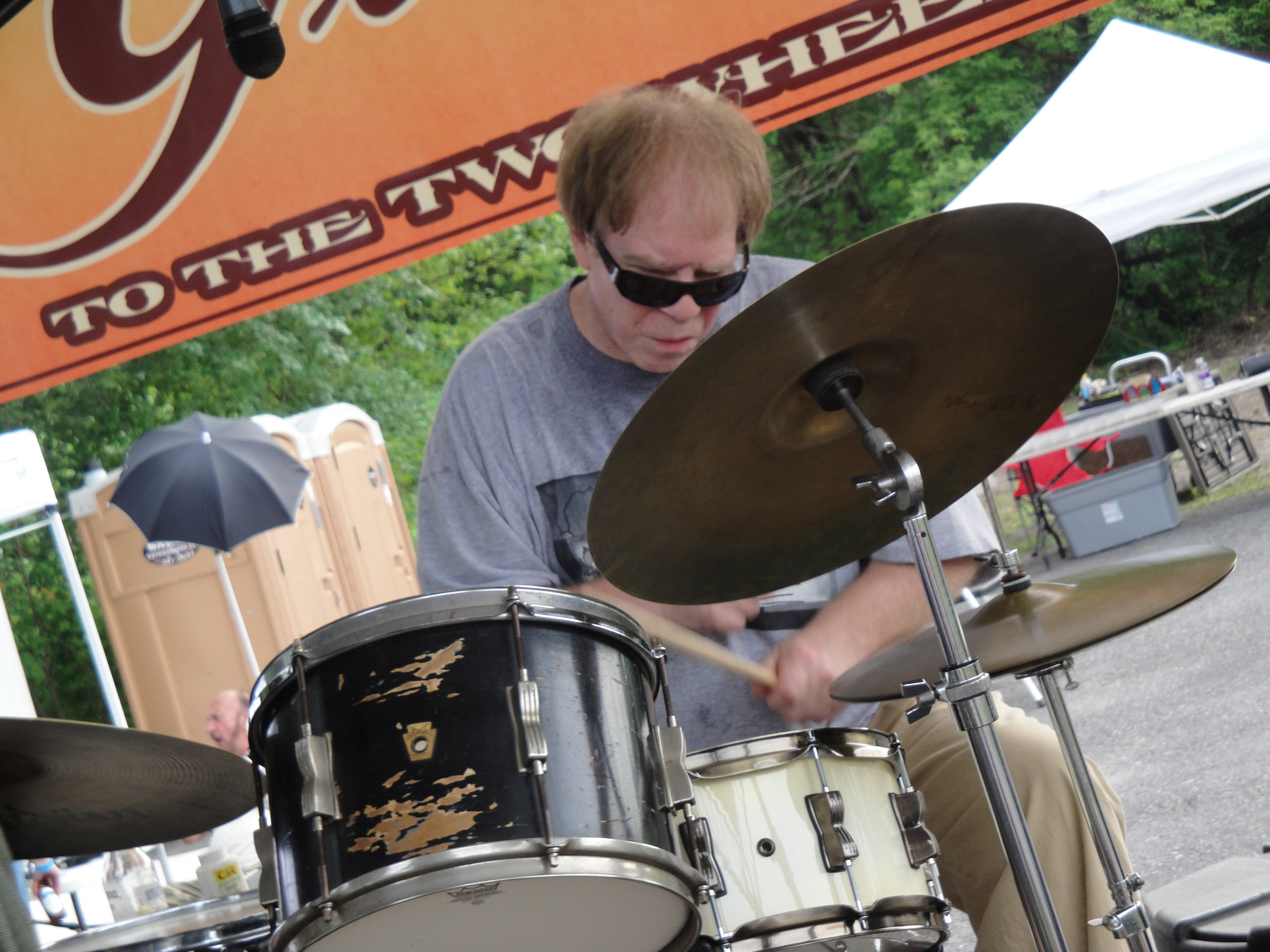 Higie's Iron Horse Saloon Summer BBQ Series — drummer performing on outdoor stage