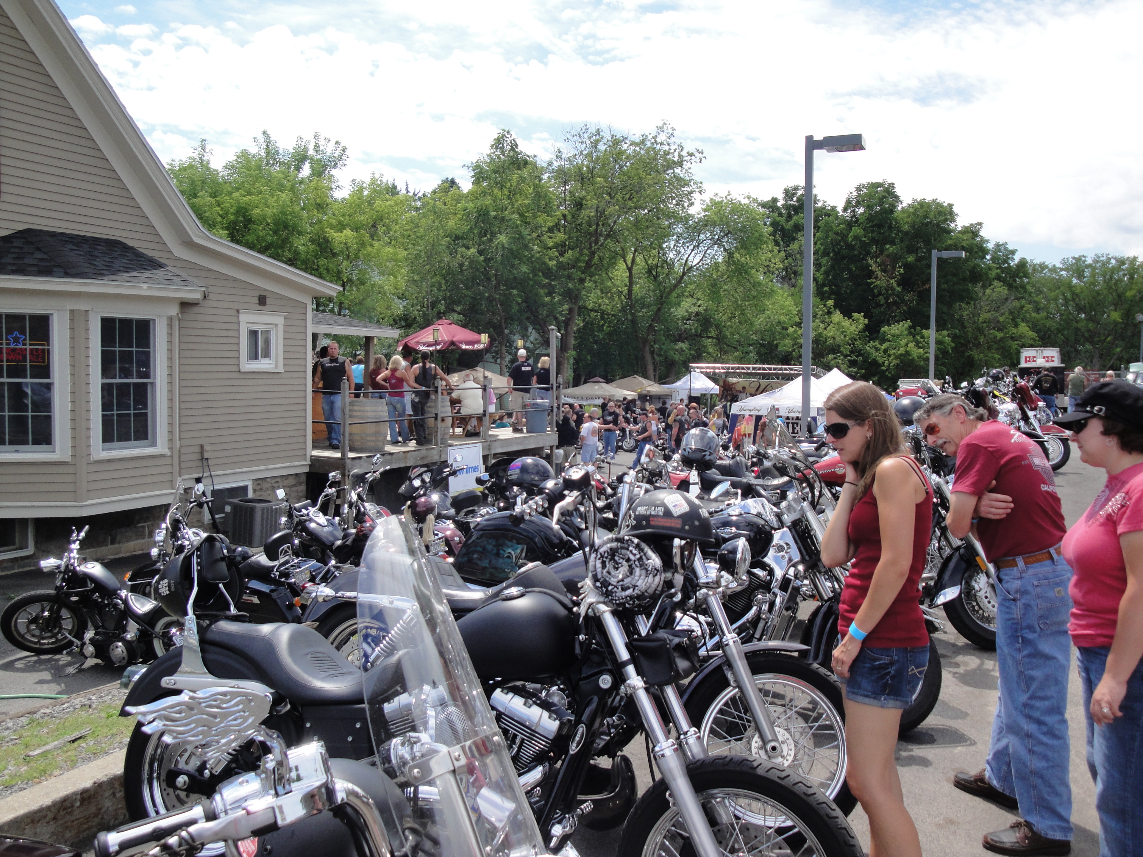 Higie's Iron Horse Saloon Summer BBQ Series — packed motorcycle parking lot at the event