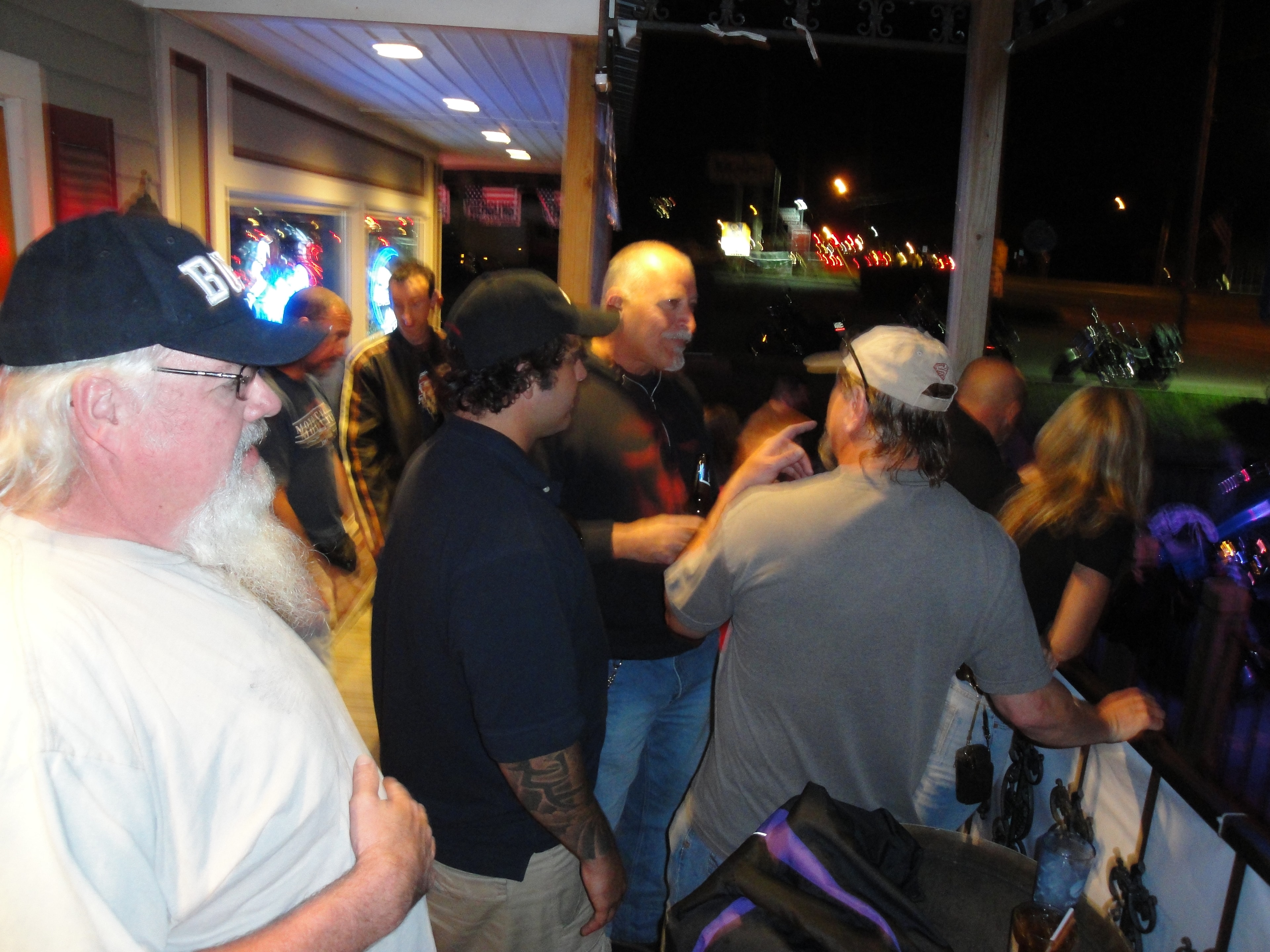 Higie's Iron Horse Saloon Summer BBQ Series — crowd gathered on the saloon porch at night
