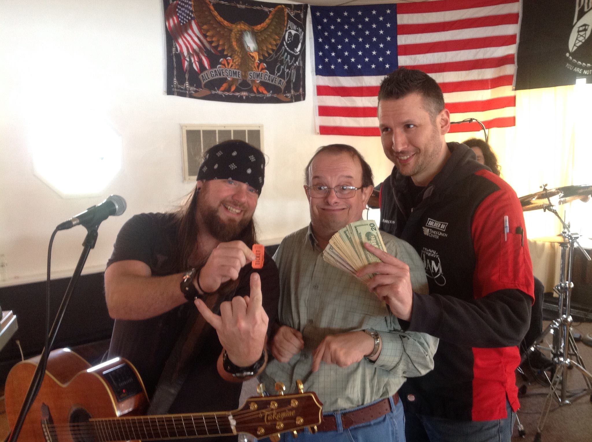 Pearl Street Jam Kick-Start Party — raffle winner with guitarist and organizer