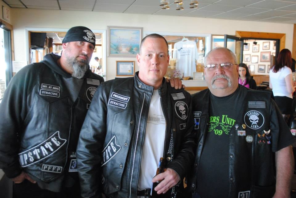 Pearl Street Jam Kick-Start Party — three men in motorcycle club vests at the event