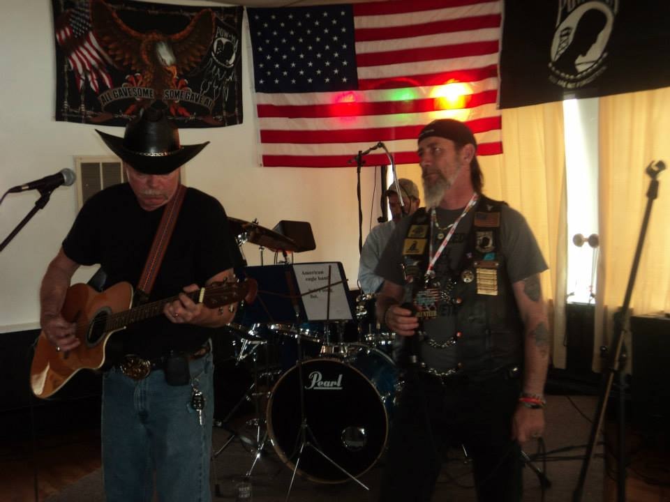 Pearl Street Jam Kick-Start Party — band performing under American flag and POW-MIA banner