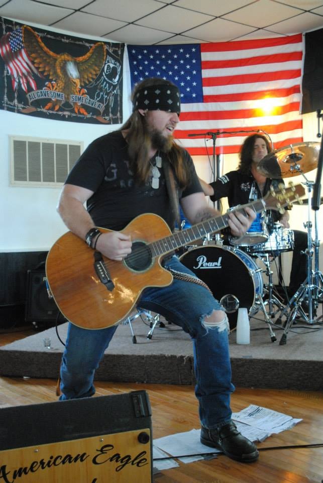 Pearl Street Jam Kick-Start Party — guitarist performing on stage with drummer
