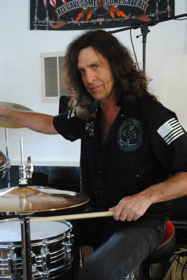 Pearl Street Jam Kick-Start Party — drummer performing on stage