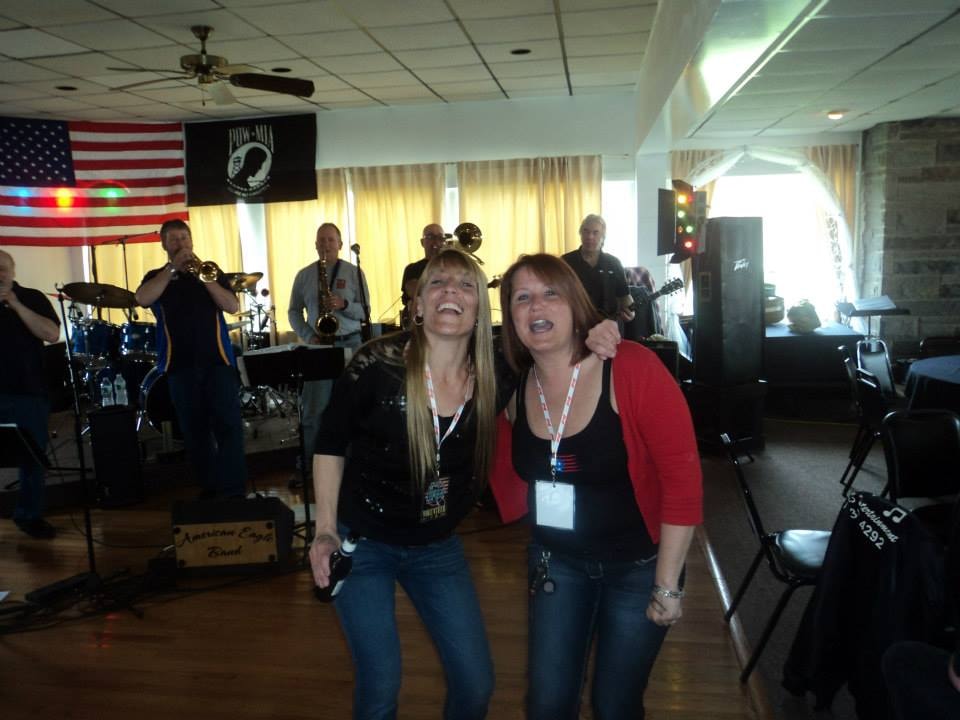 Pearl Street Jam Kick-Start Party — two women dancing in front of American Eagle Band