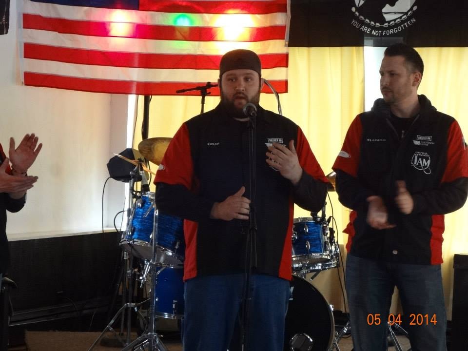 Pearl Street Jam Kick-Start Party — Griz and Marcus speaking at microphone on stage