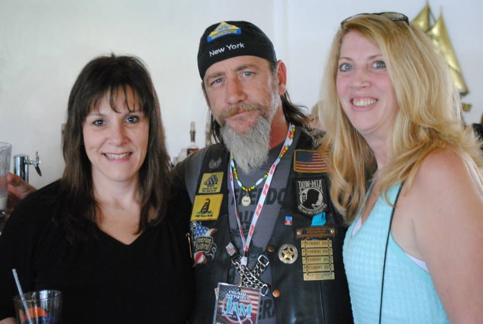 Pearl Street Jam Kick-Start Party — two women and veteran biker posing together