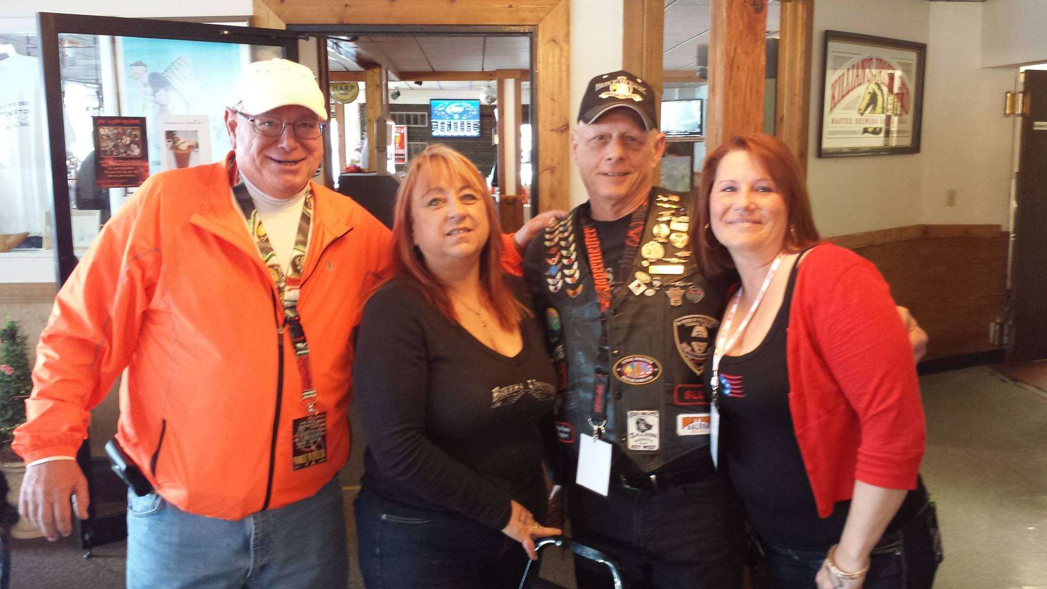 Pearl Street Jam Kick-Start Party — four people posing indoors including veteran in patch vest