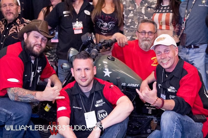Pearl Street Jam — crew posing with US Army motorcycle at event