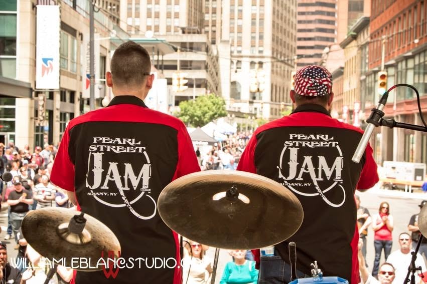 Pearl Street Jam — two crew members backs to camera overlooking Pearl Street crowd