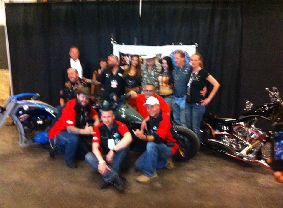 Pearl Street Jam — group photo with custom motorcycles at indoor show