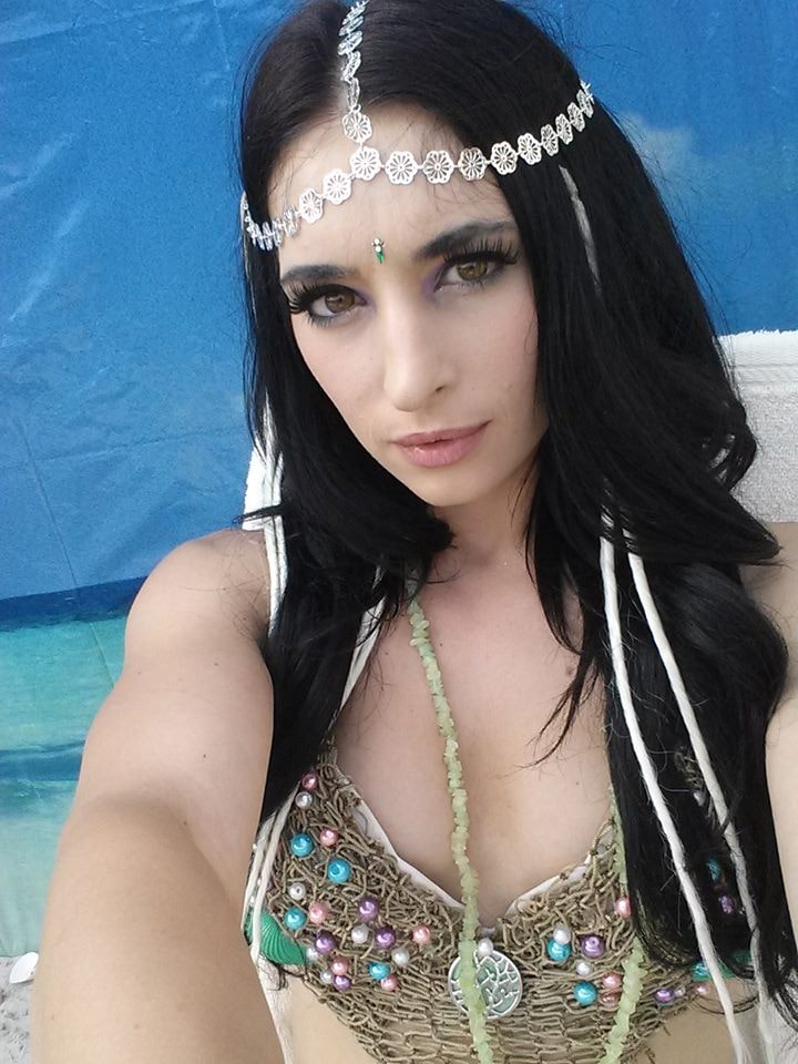Woody's Pirate Party — mermaid performer selfie with silver flower headpiece and dramatic eye makeup