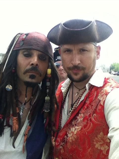 Woody's Pirate Party — Jack Sparrow lookalike posing with man in red brocade vest pirate costume